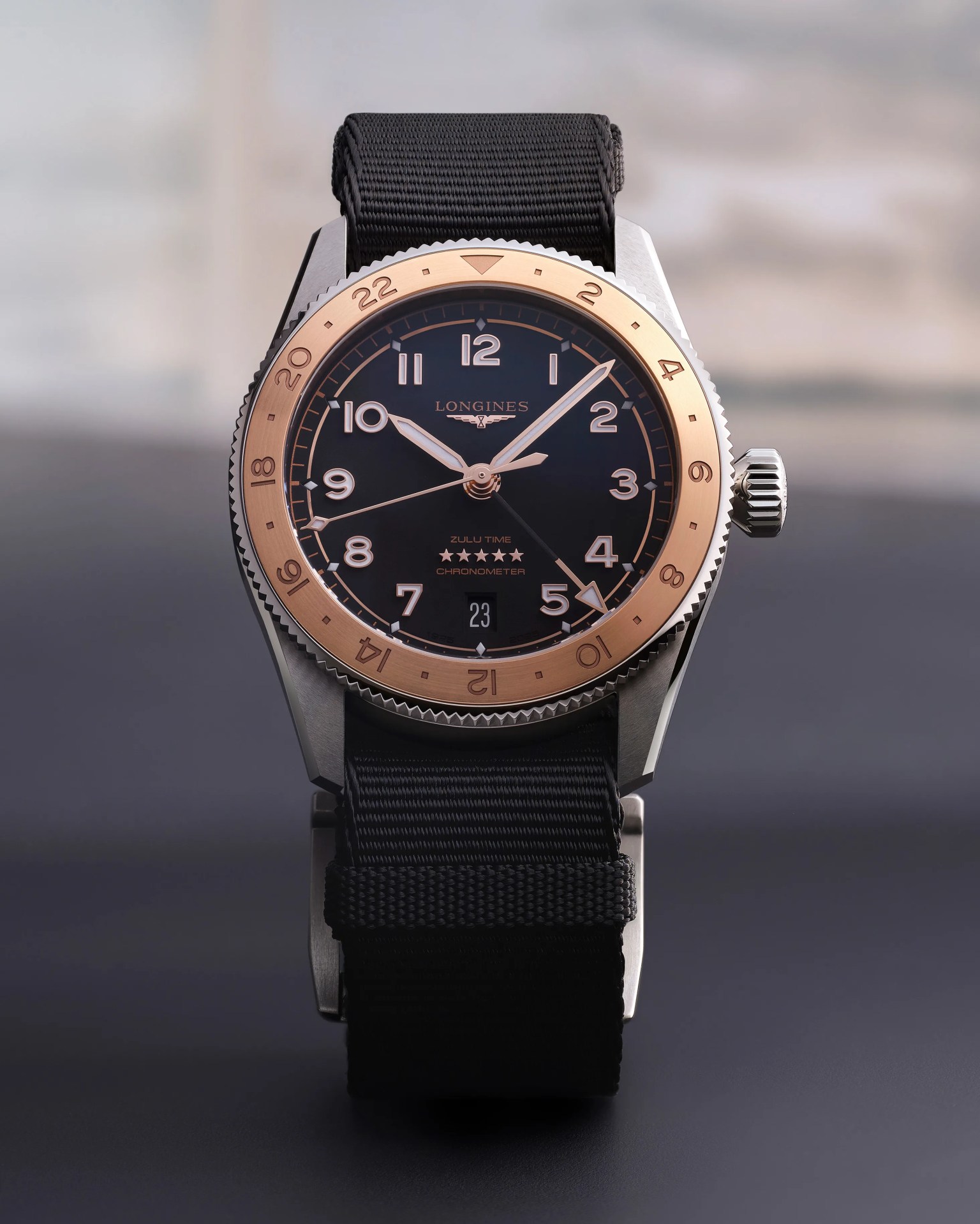 a Longines watch with a black dial