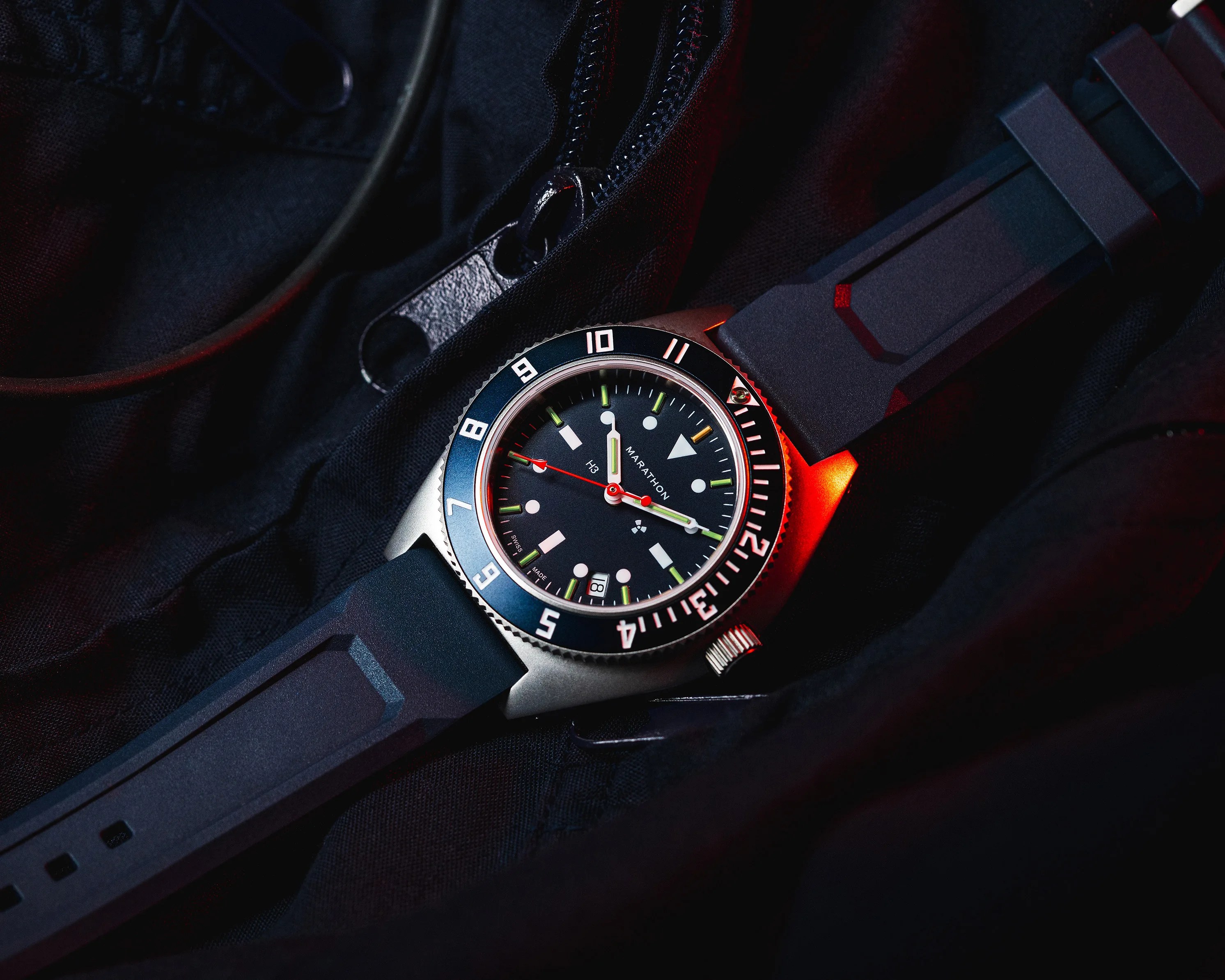 a Marathon watch laying flat on a jacket