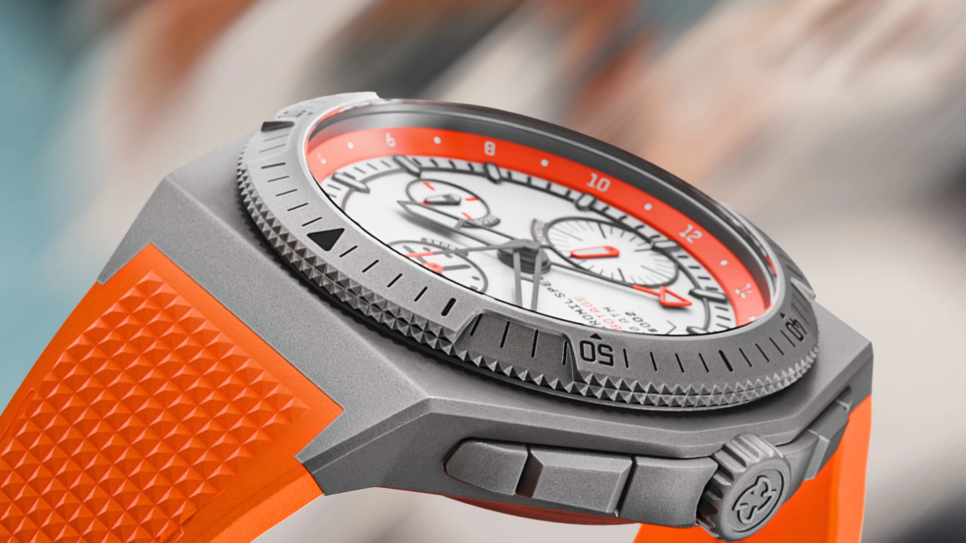 a watch with an orange brand
