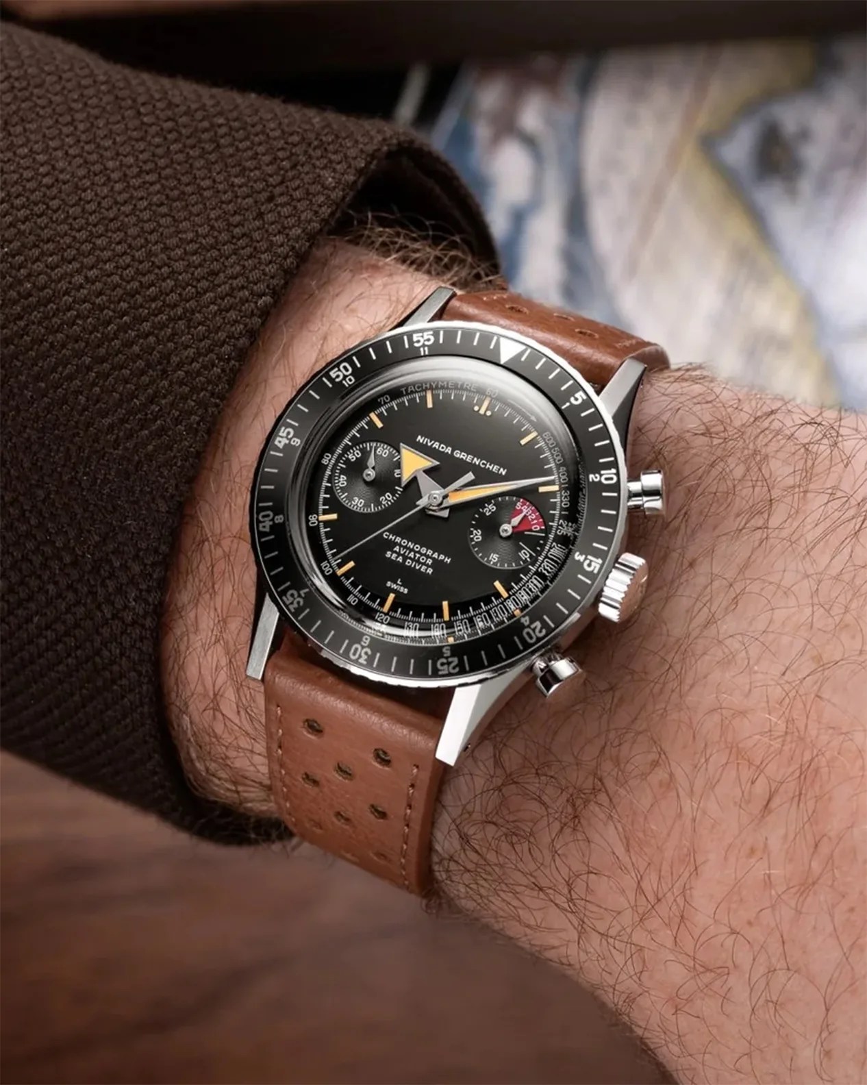 a Nivada Grenchen watch on a man's wrist