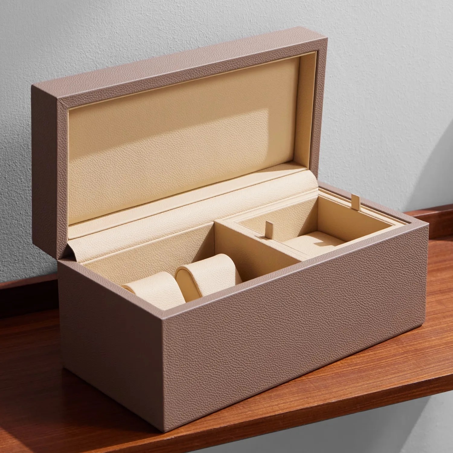 a taupe leather watch and jewelry case