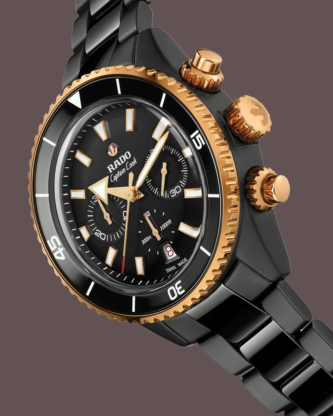 a black and gold Rado chronograph watch