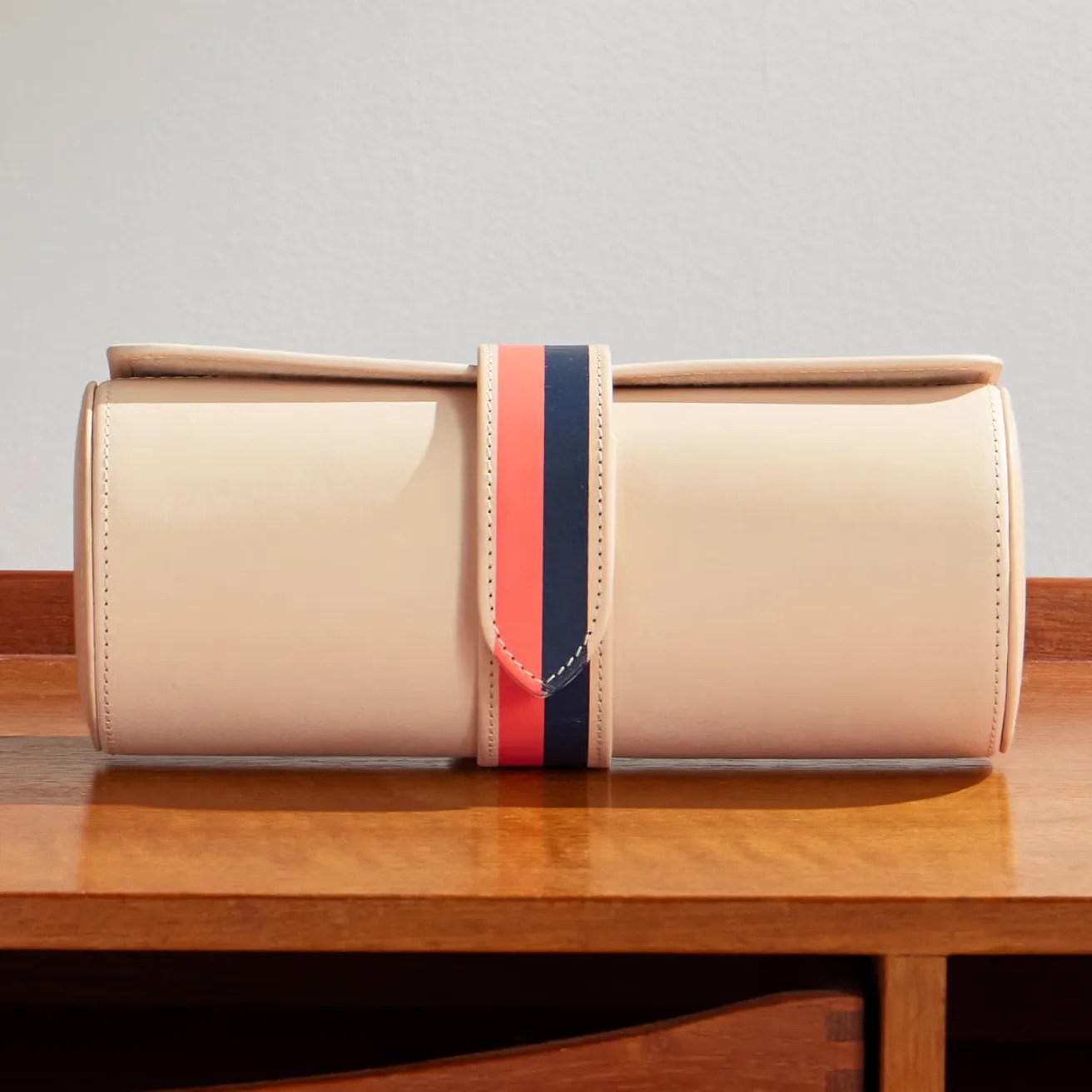 a tan leather watch travel case