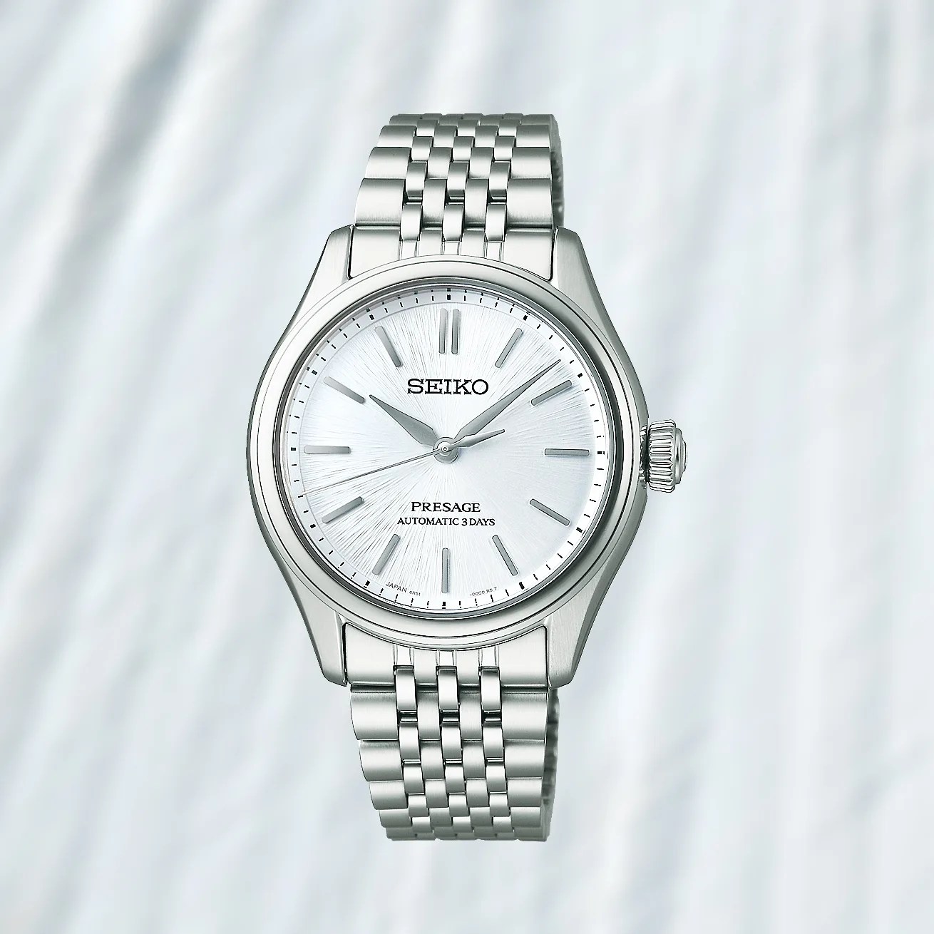 a Seiko dress watch with a silver dial