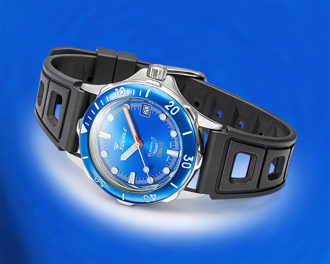 a Squale dive watch with a black rubber strap