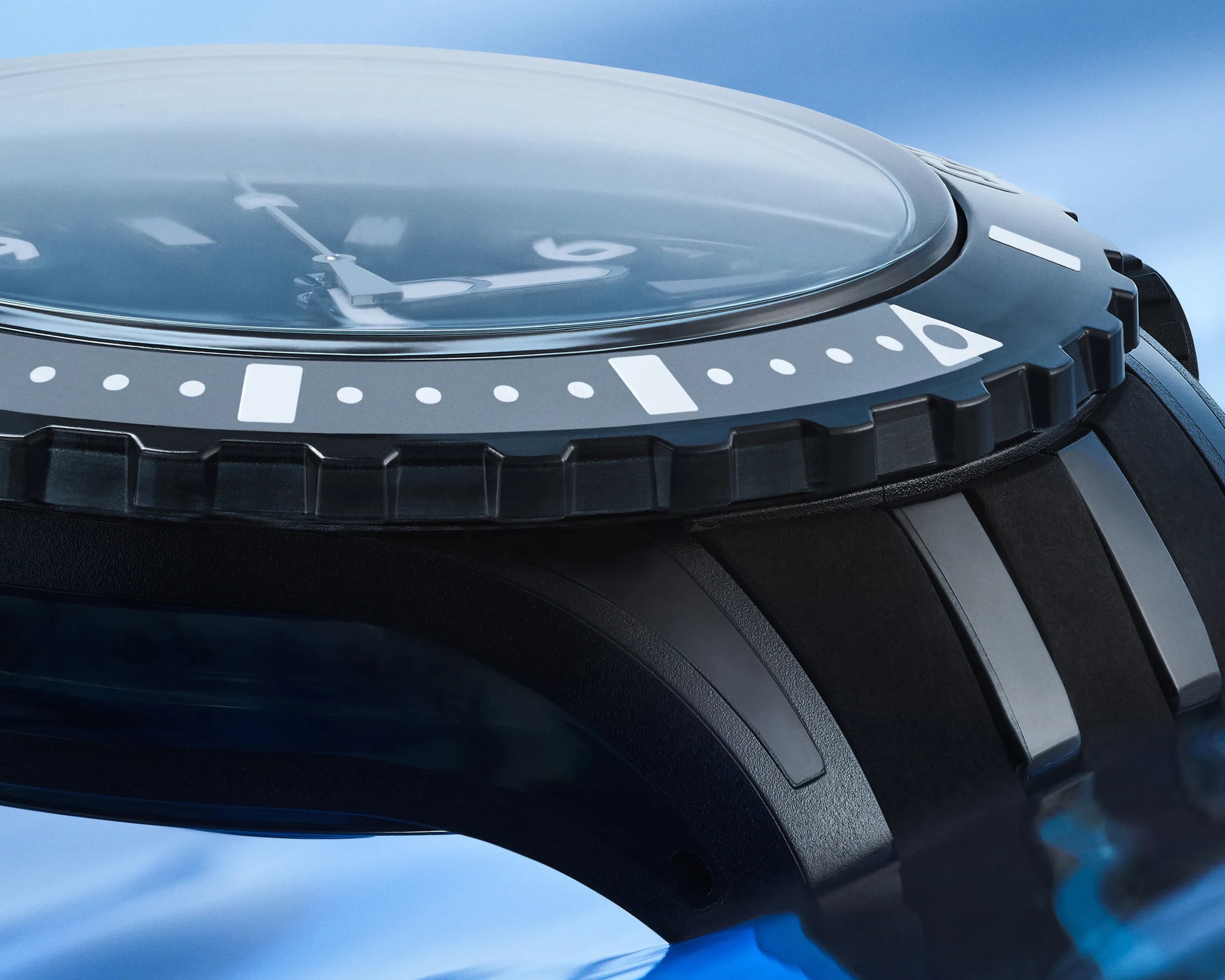 the crown of a black Swatch dive watch