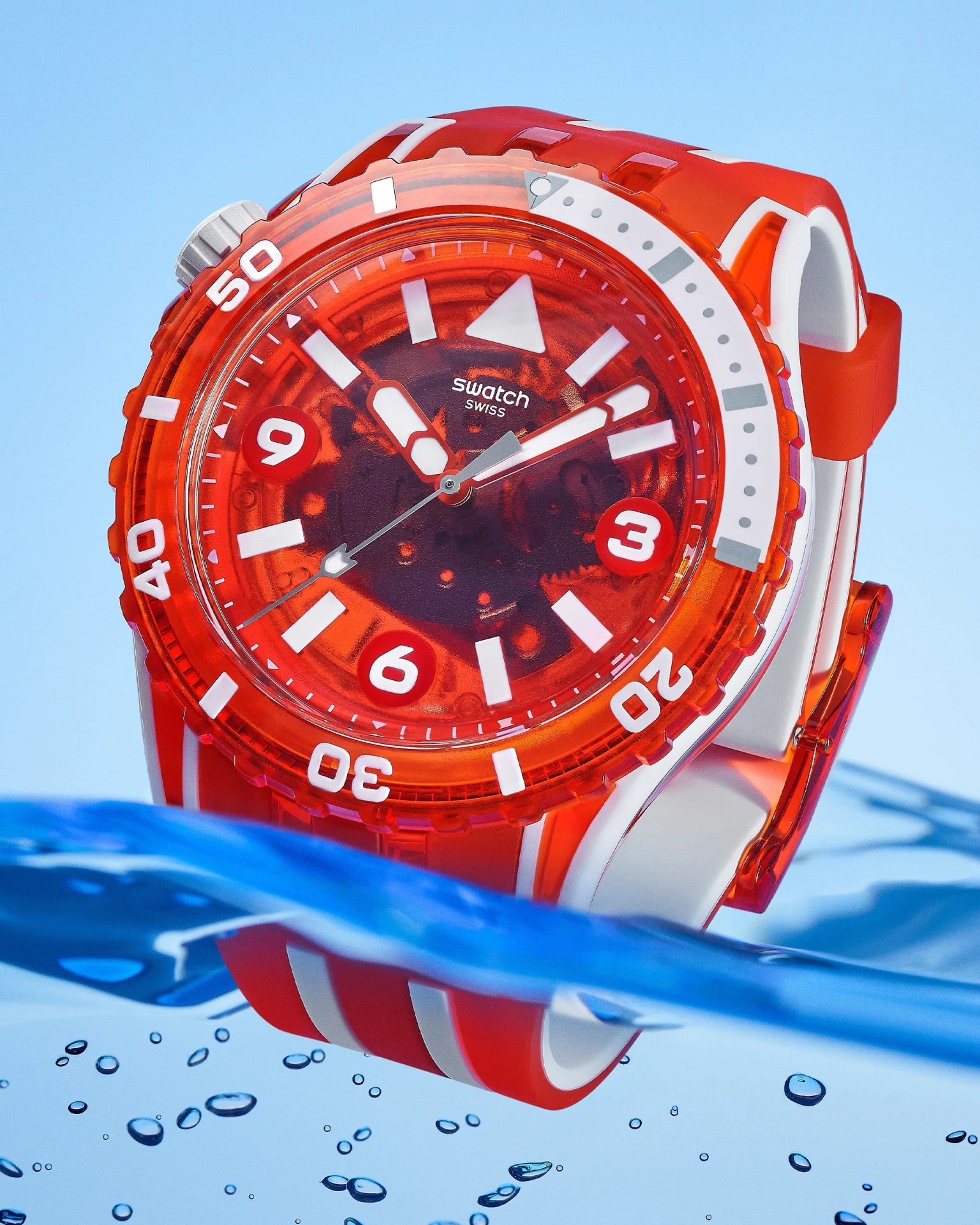 a red Swatch dive watch