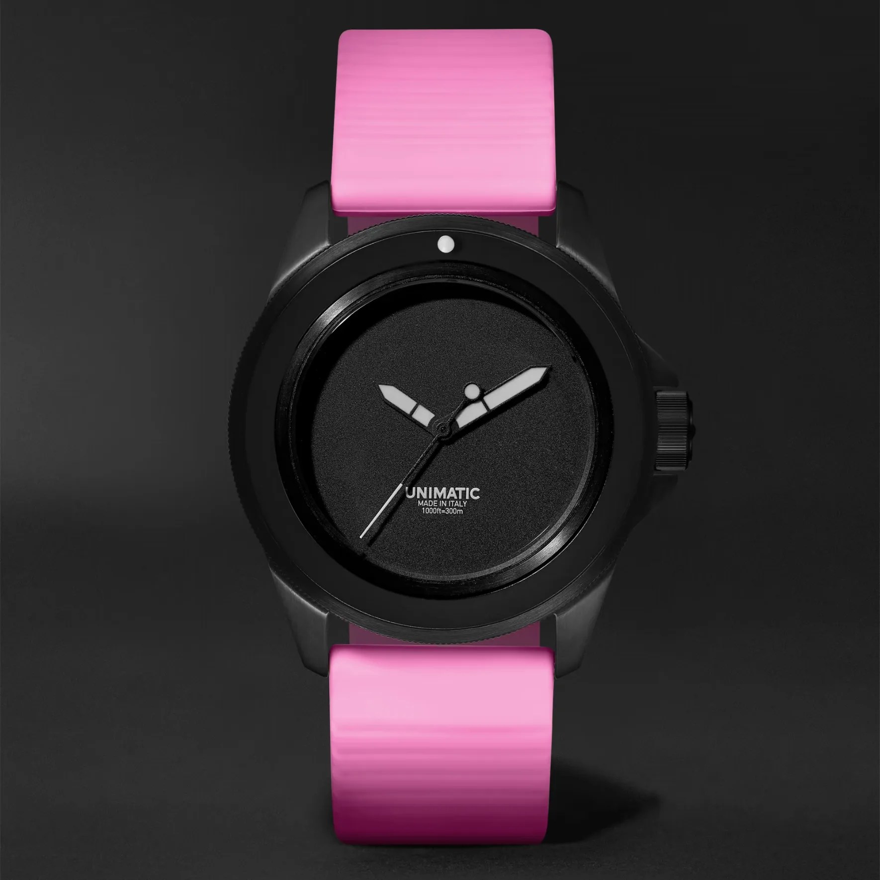 a black and pink unimatic watch