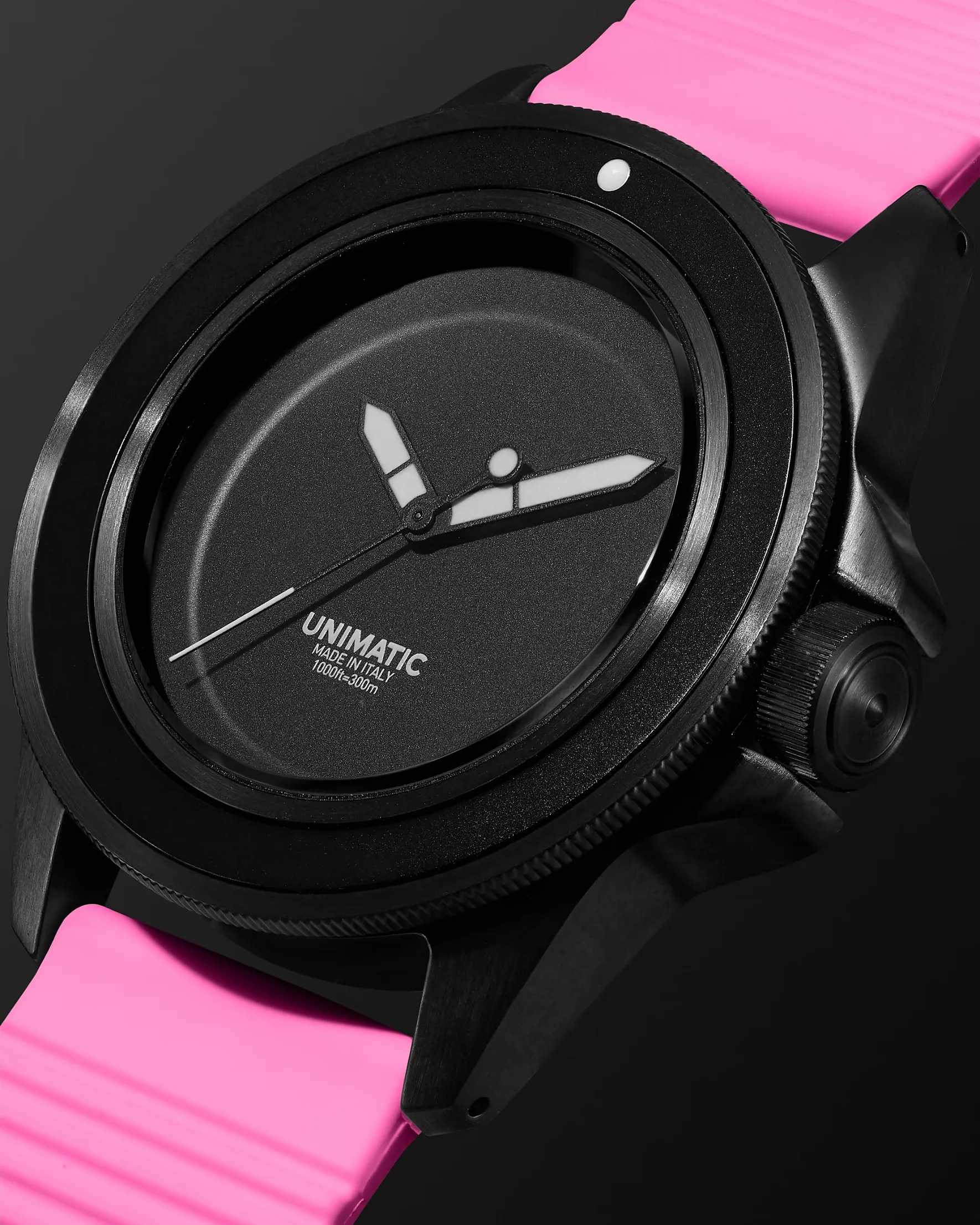 a black and pink unimatic watch