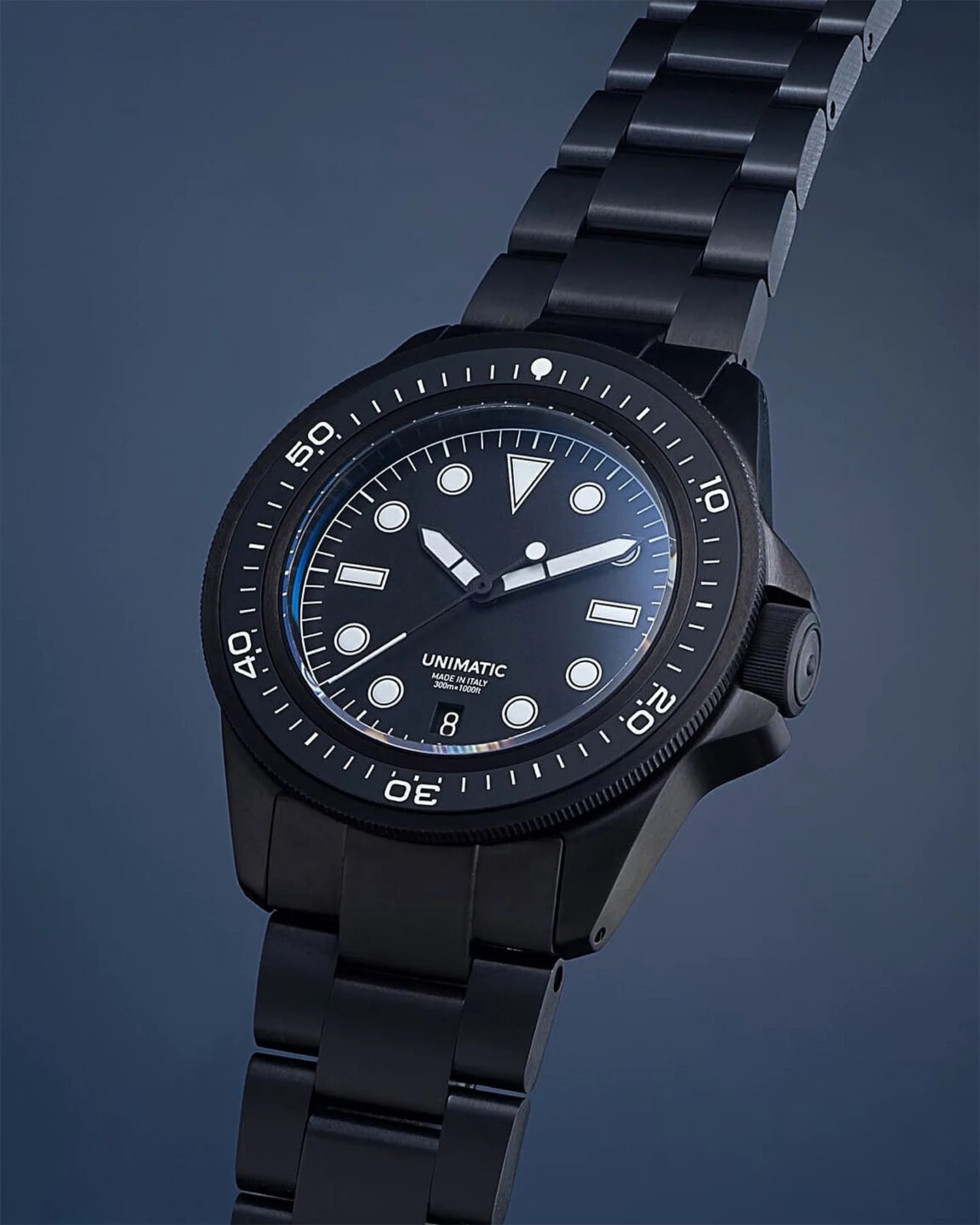the front and crown of a Unimatic dive watch