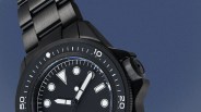 a black Unimatic dive watch