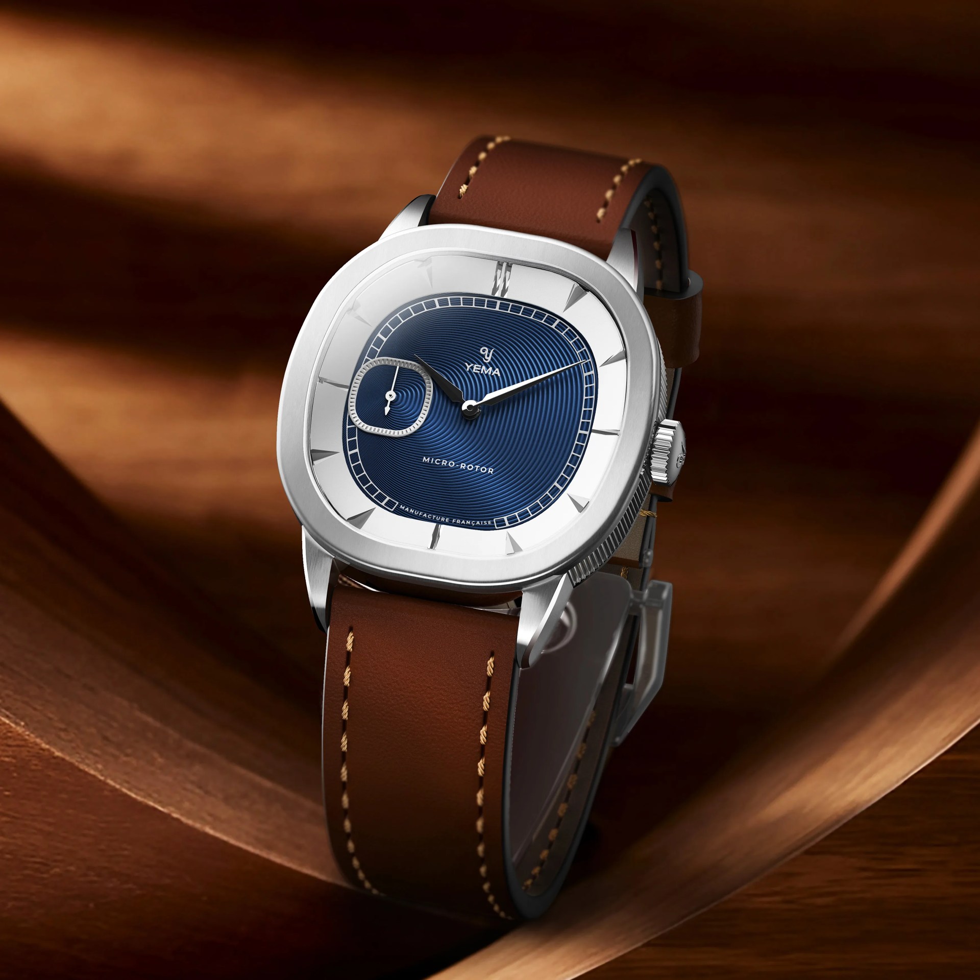 a Yema dress watch with a blue dial