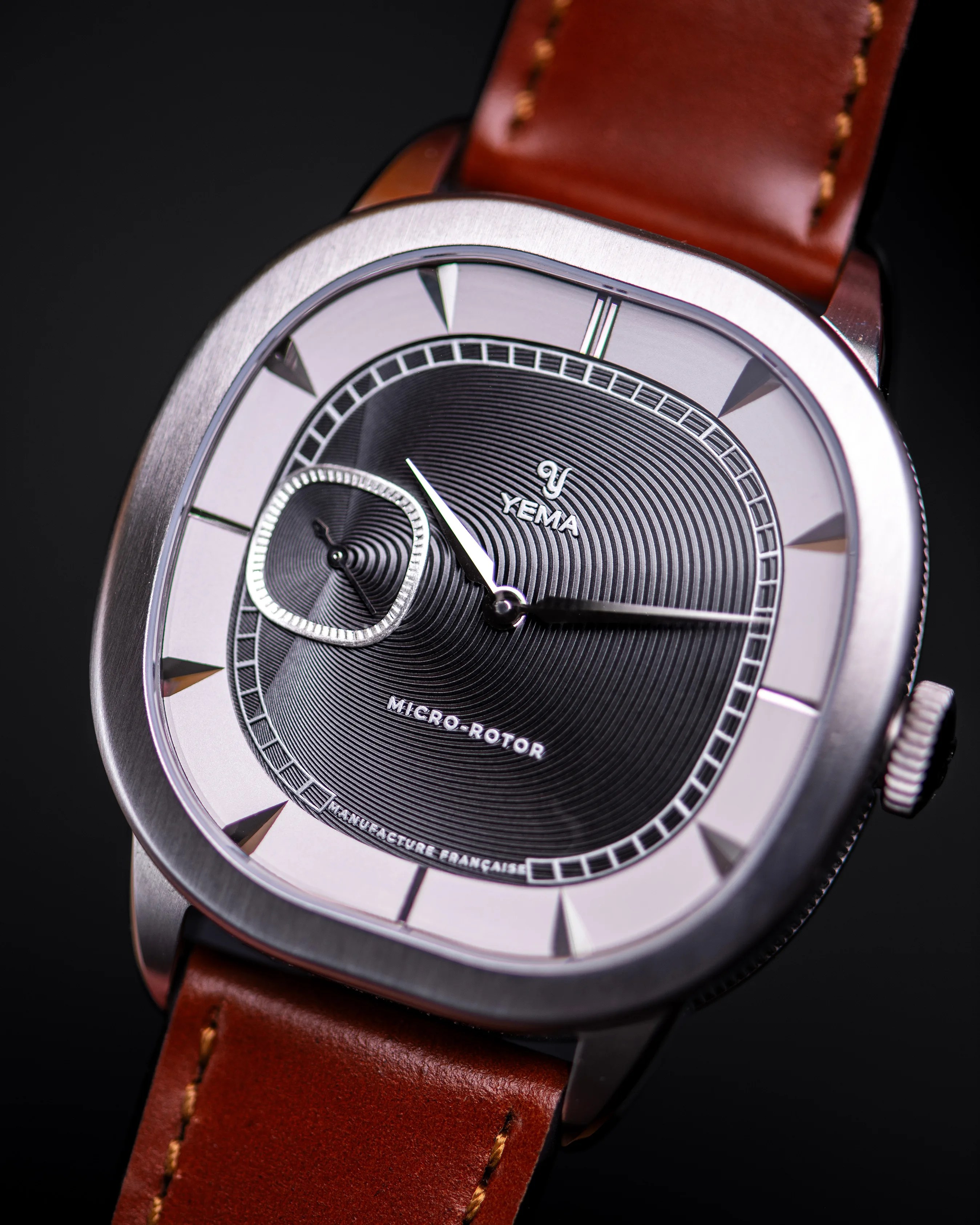 a Yema dress watch with a gray dial