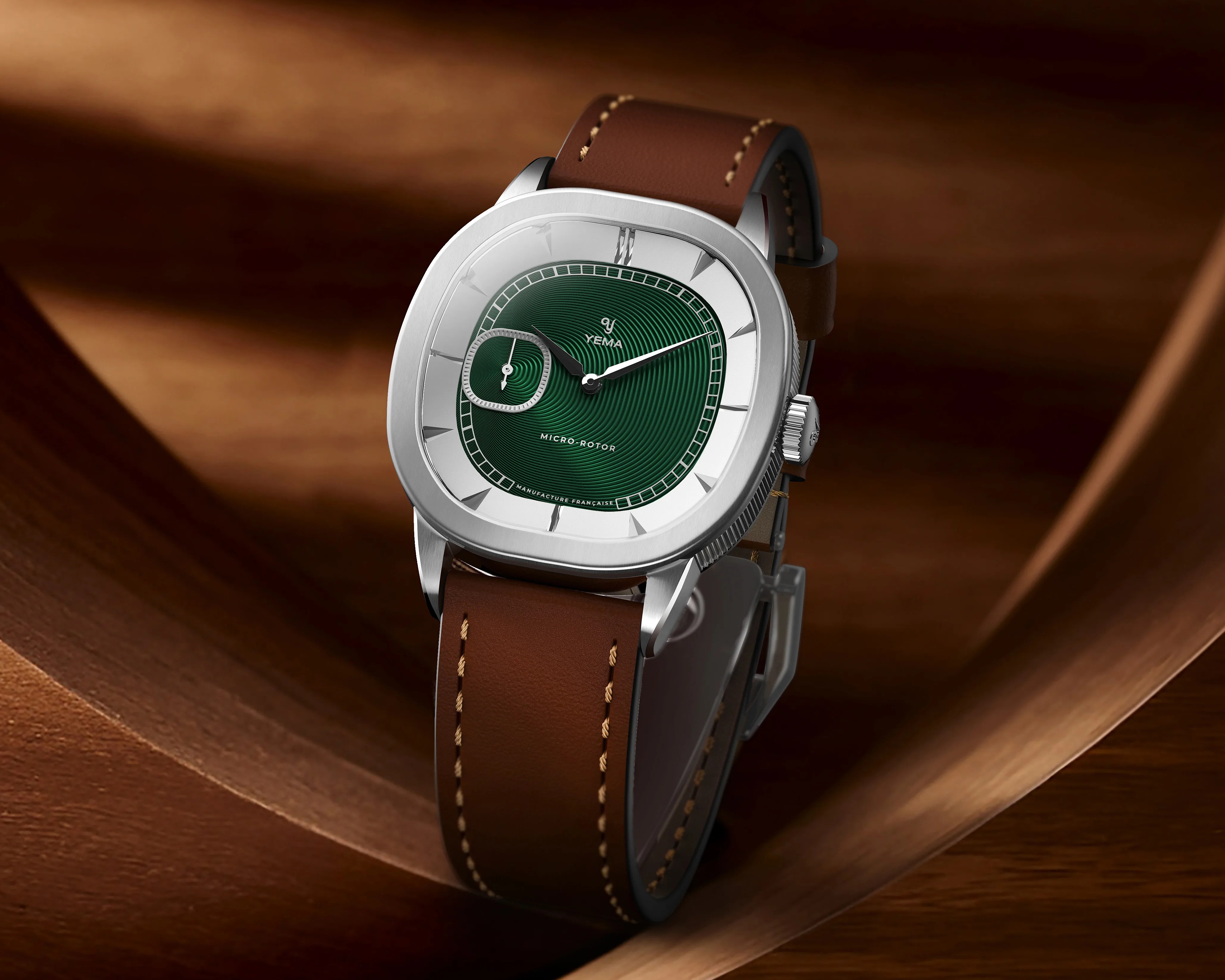 a green Yema dress watch with a leather strap
