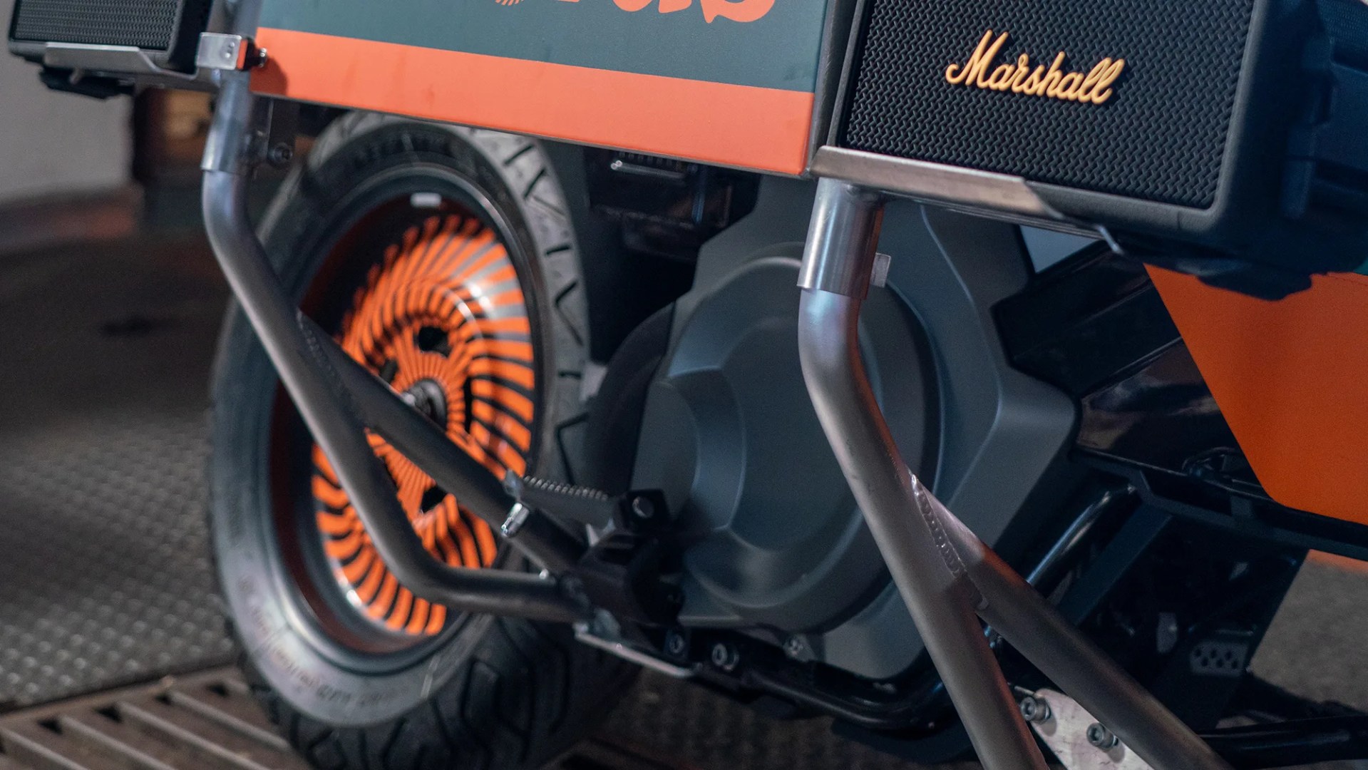 BMW x Deus Ex Machina DE 02 Electric Motorcycle wheel and speaker closeup
