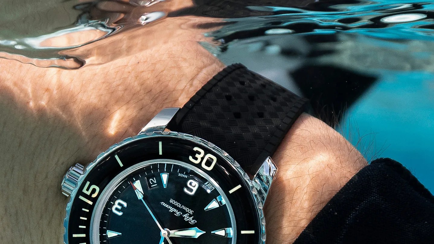 a Blancpain dive watch on a diver's wrist