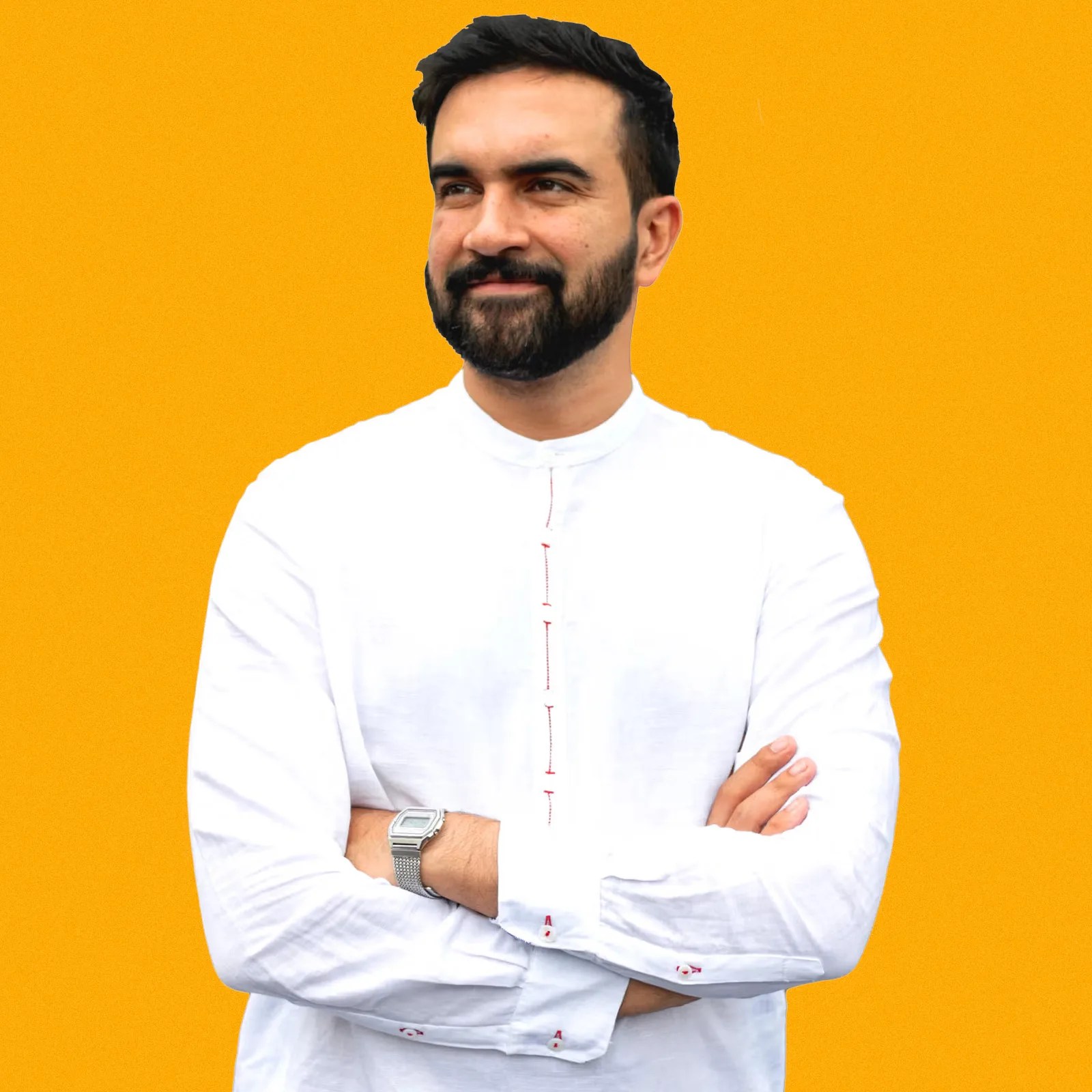 A portrait of Zohran Mamdani with his arms crossed wearing a white shirt and a Casio A1000MA-7 digital watch