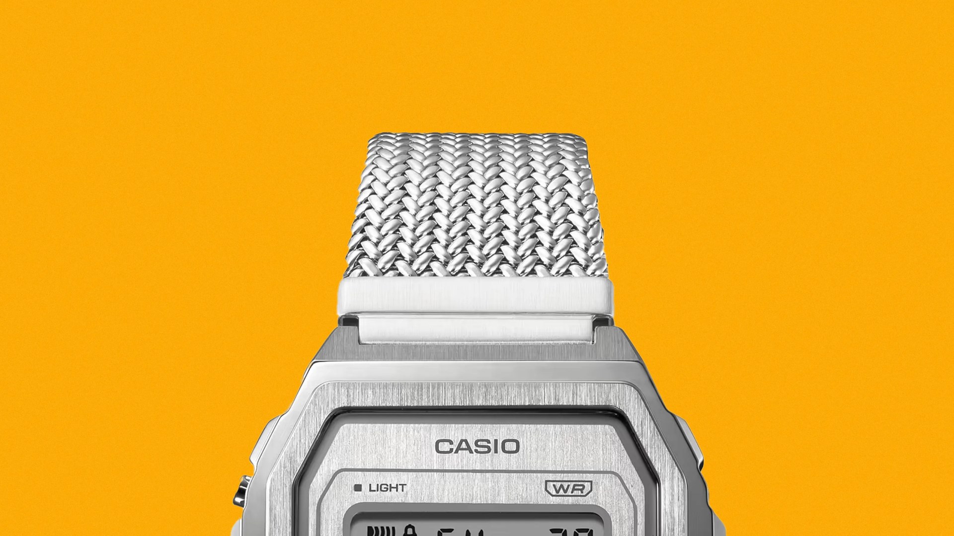 A close-up of the upper half of the Casio A1000MA-7VT against a golden yellow background