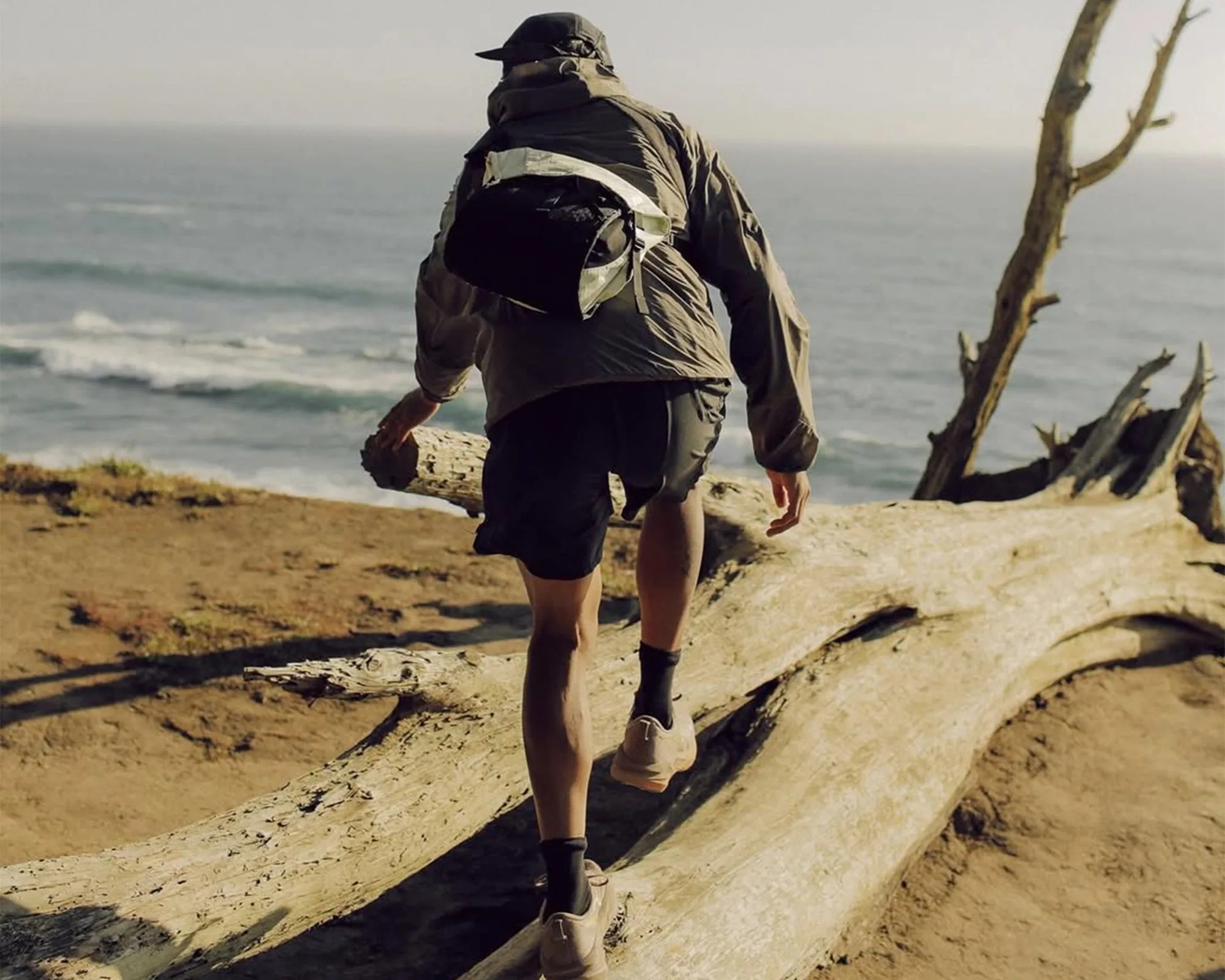 DSPTCH Zero-1 Messenger EDC Bag on person's back on beach hike