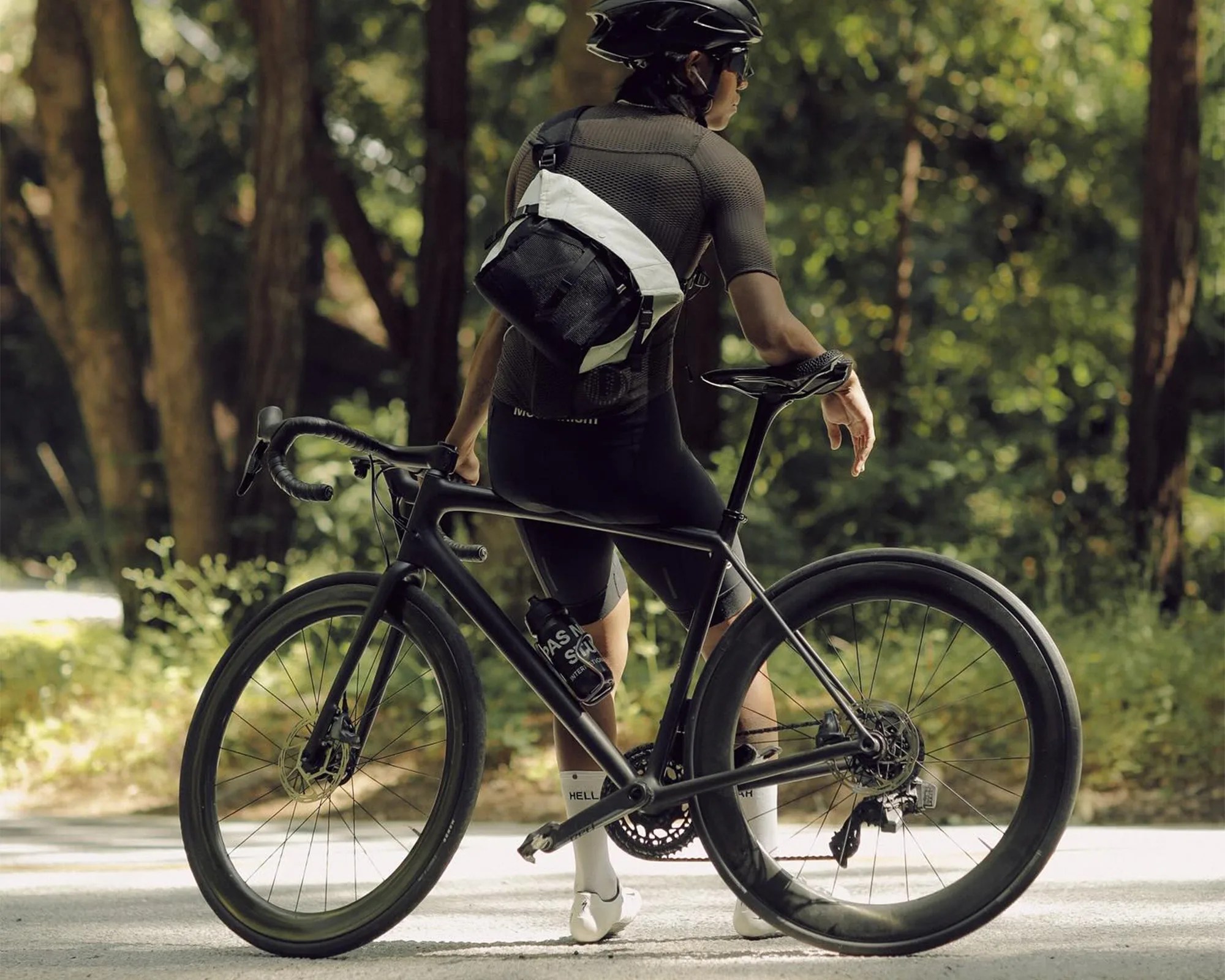 DSPTCH Zero-1 Messenger EDC Bag on cyclist's back