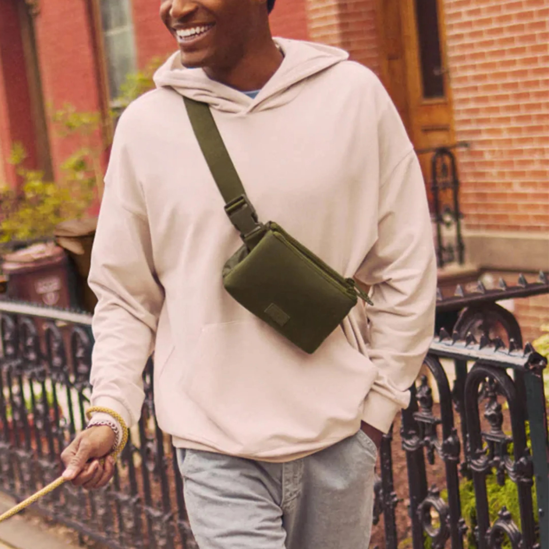 Dagne and Dover Bennie Day Sling lifestyle man walking down street