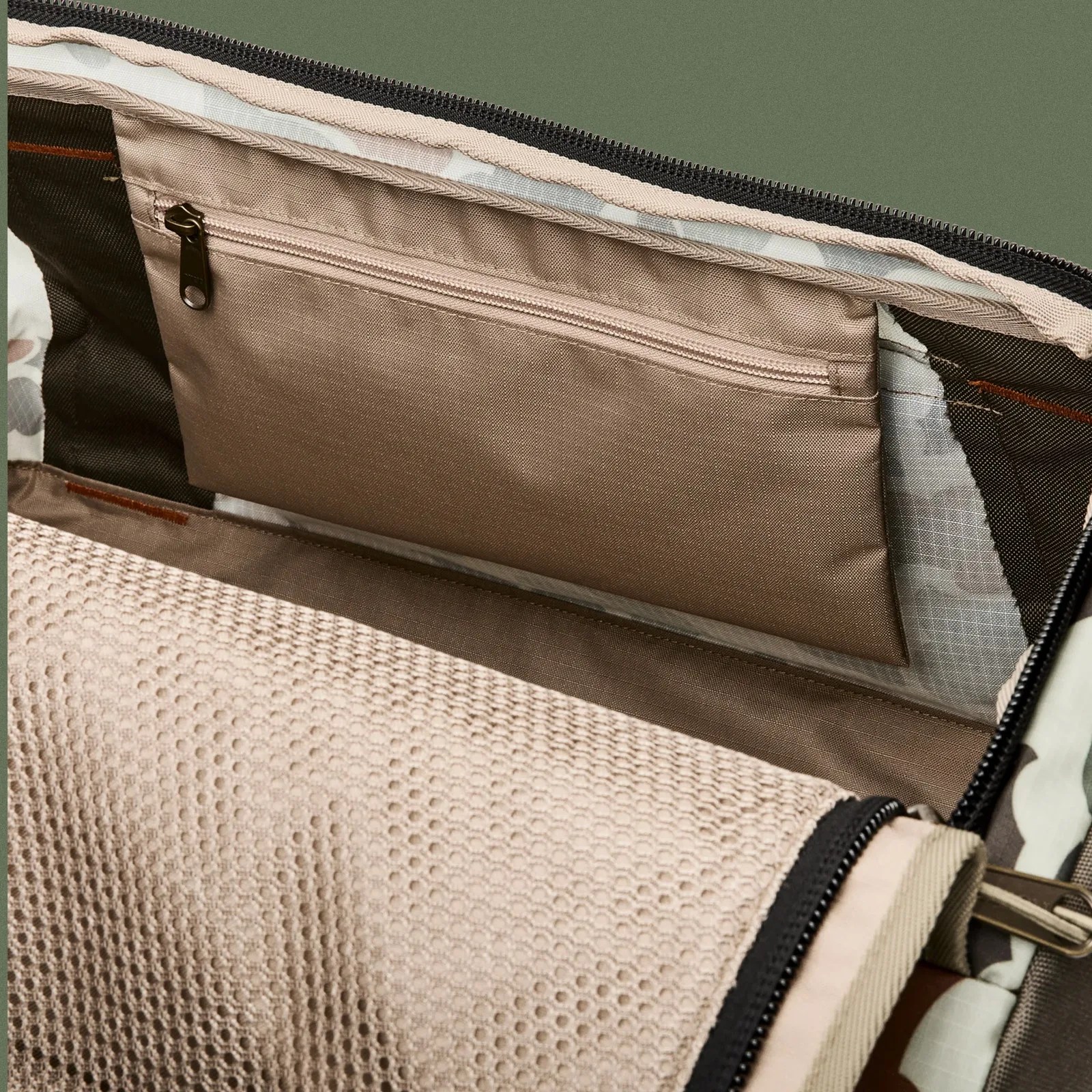 A close-up of the interior zip pocket of the Filson Scout All-Weather 50L Duffle