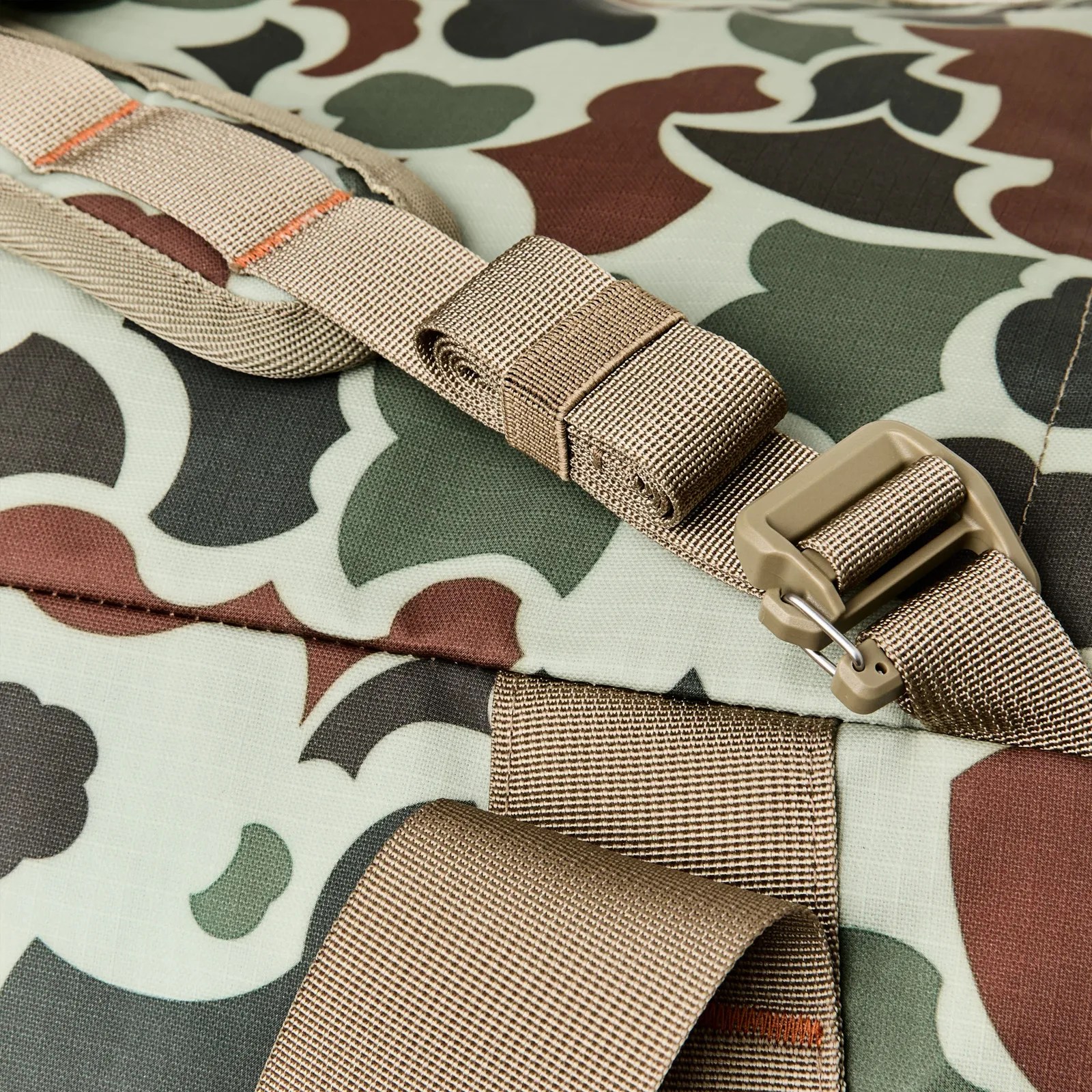 A close-up of the strap cinch on the Filson Scout All-Weather 50L Duffle