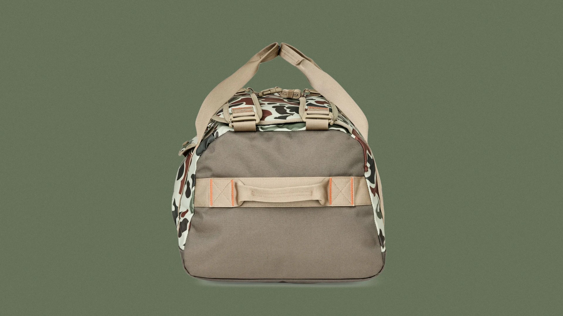 Filson All-Weather 50L Duffle Bag in Shrub Camo against a dark green background