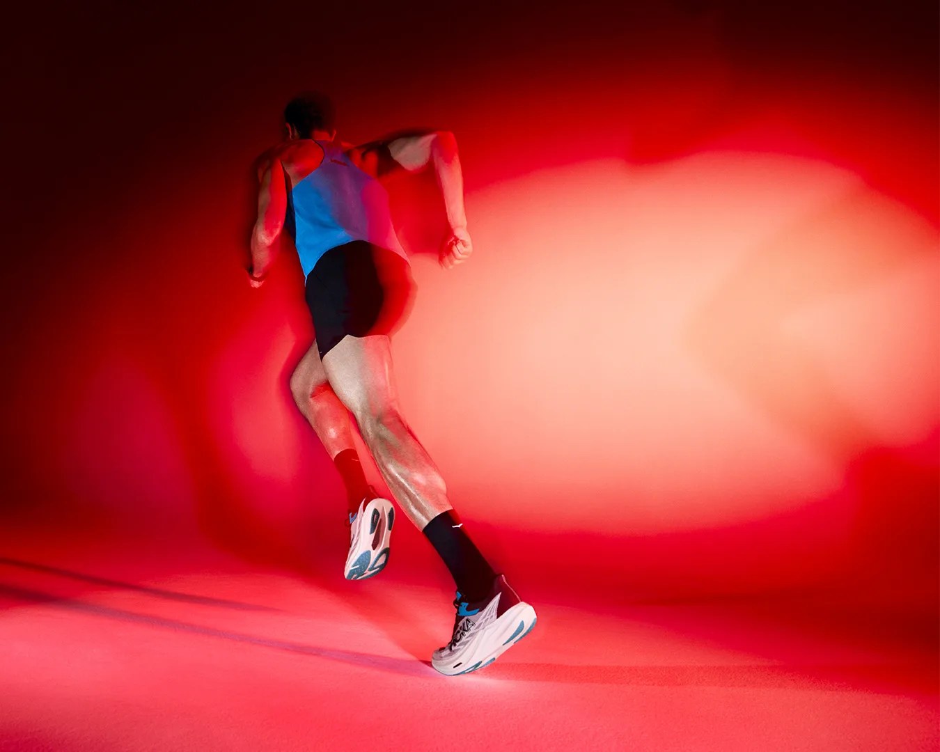 man running wearing Hoka sneakers