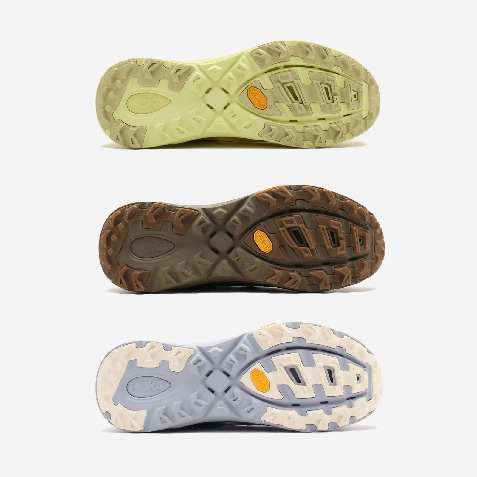 Three of Hoka Mafate Three2 Grid JP shoes in different colors stacked vertically to show the sneaker's sole designs. 