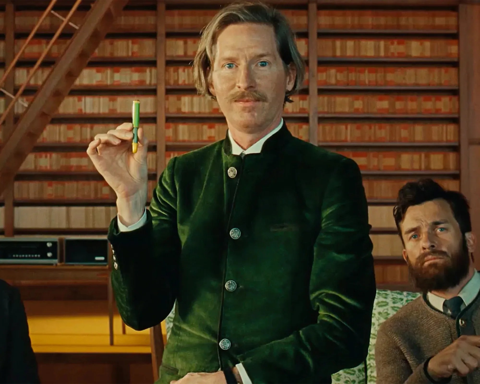 Wes Anderson holding his Montblanc The Schreiberling pen (with Rupert Friend looking over his shoulder)