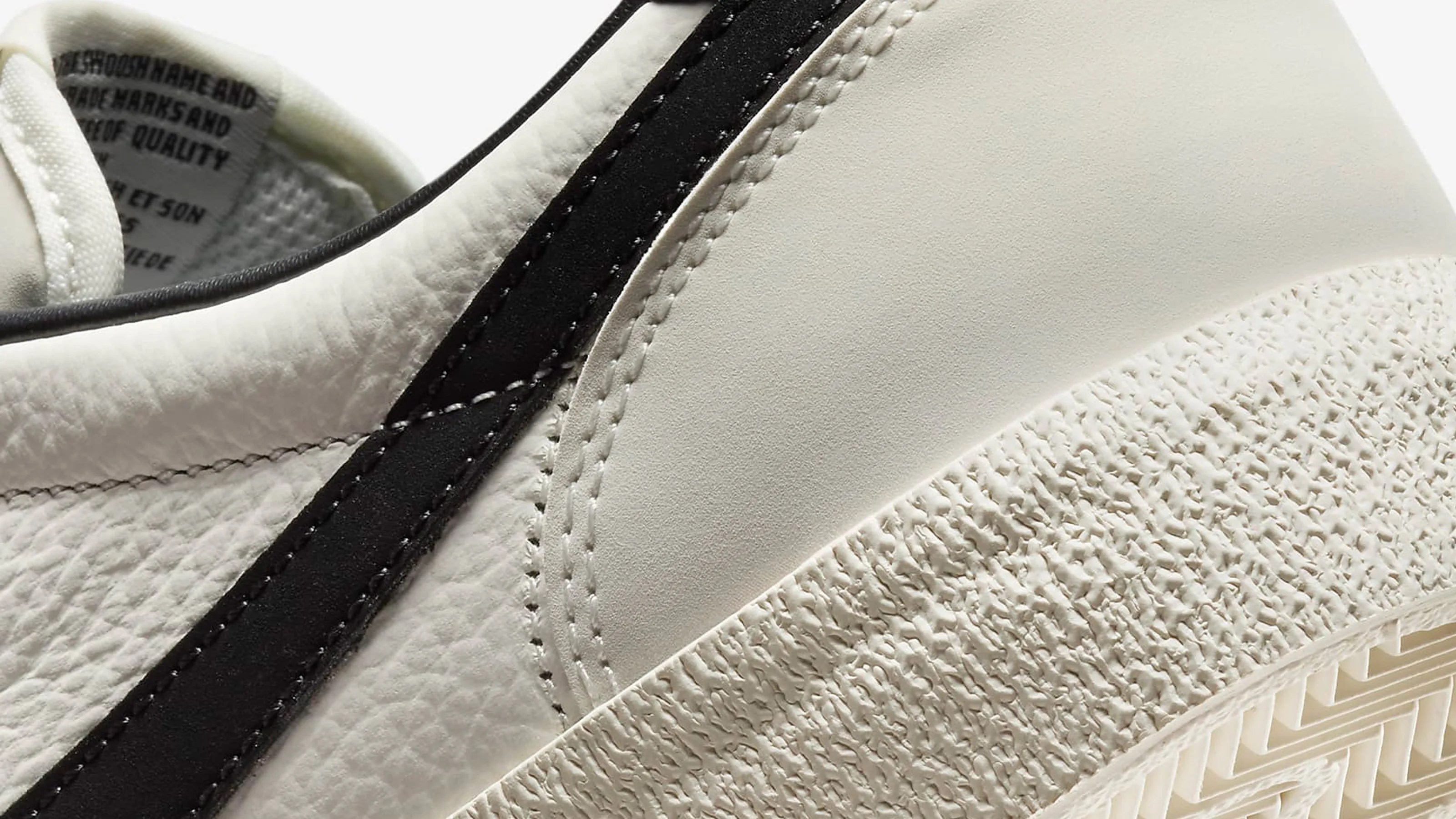 A close-up of the side and heel of the Nike Killshot 2 Leather sneaker in white and black
