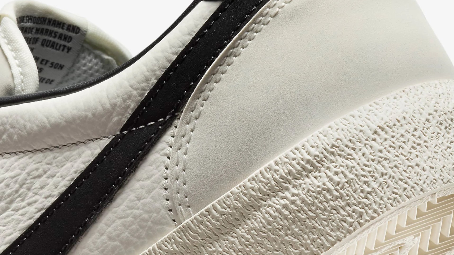 A close-up of the side and heel of the Nike Killshot 2 Leather sneaker in white and black