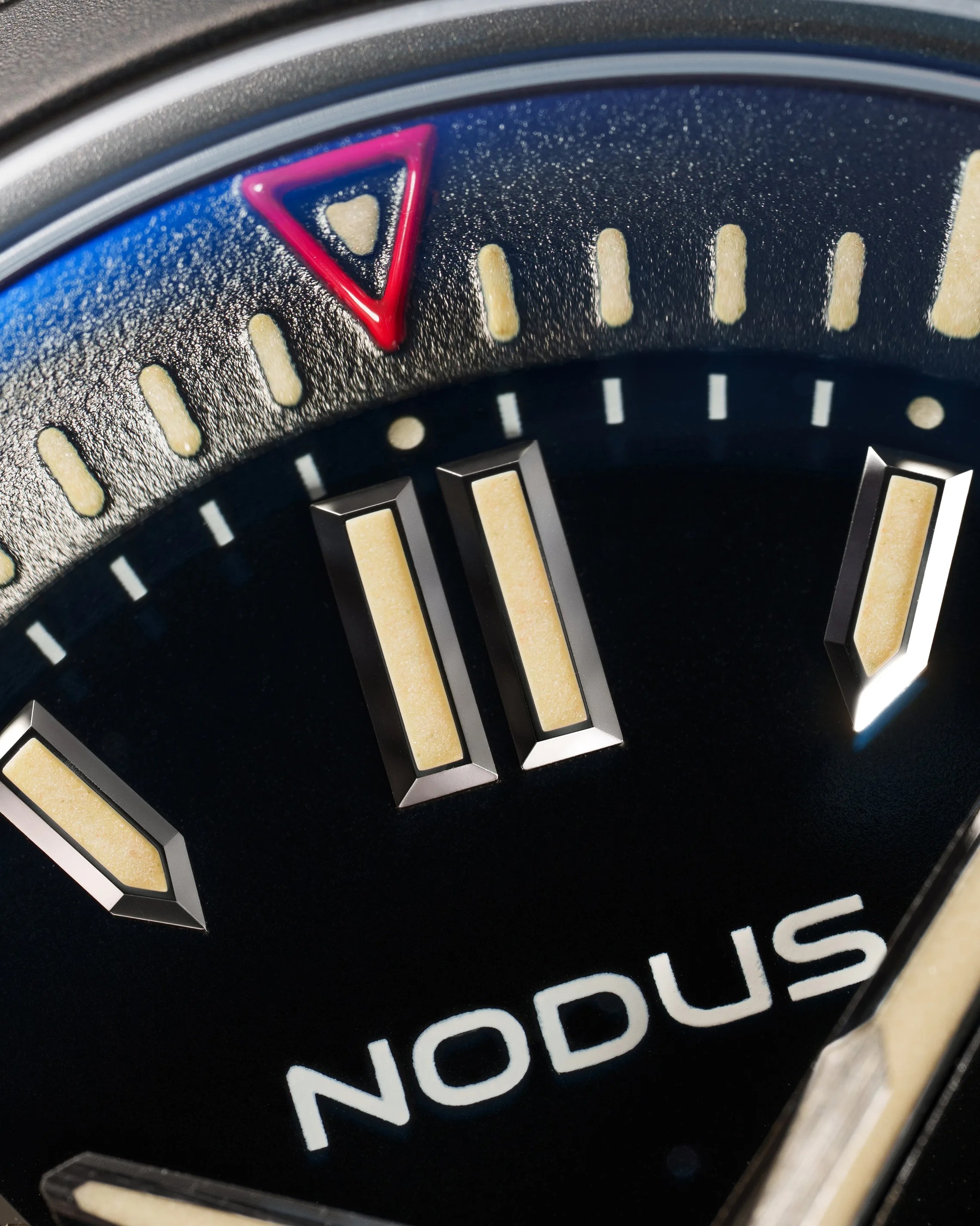 a black dial on a Nodus dive watch