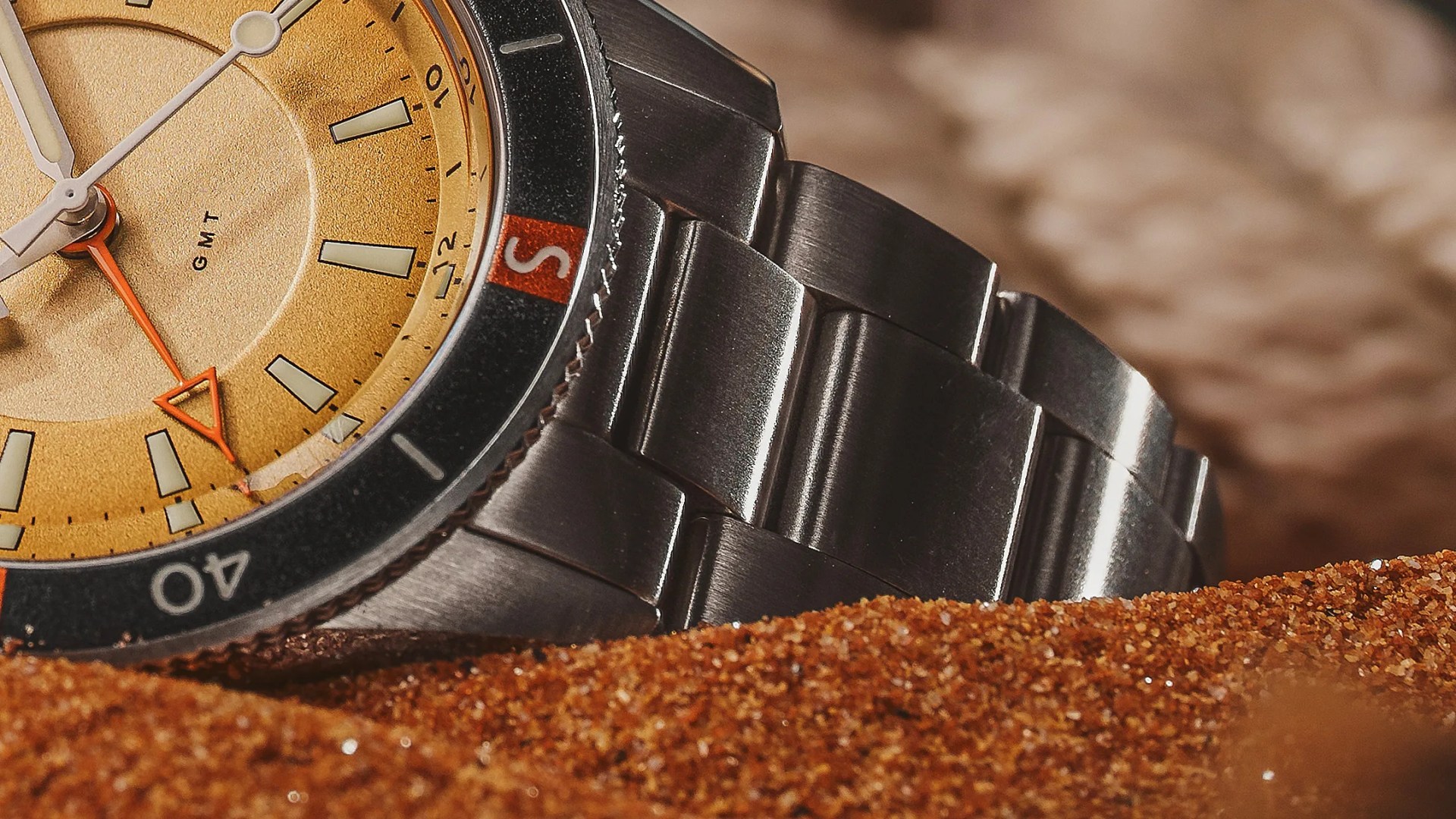 a watch in sand