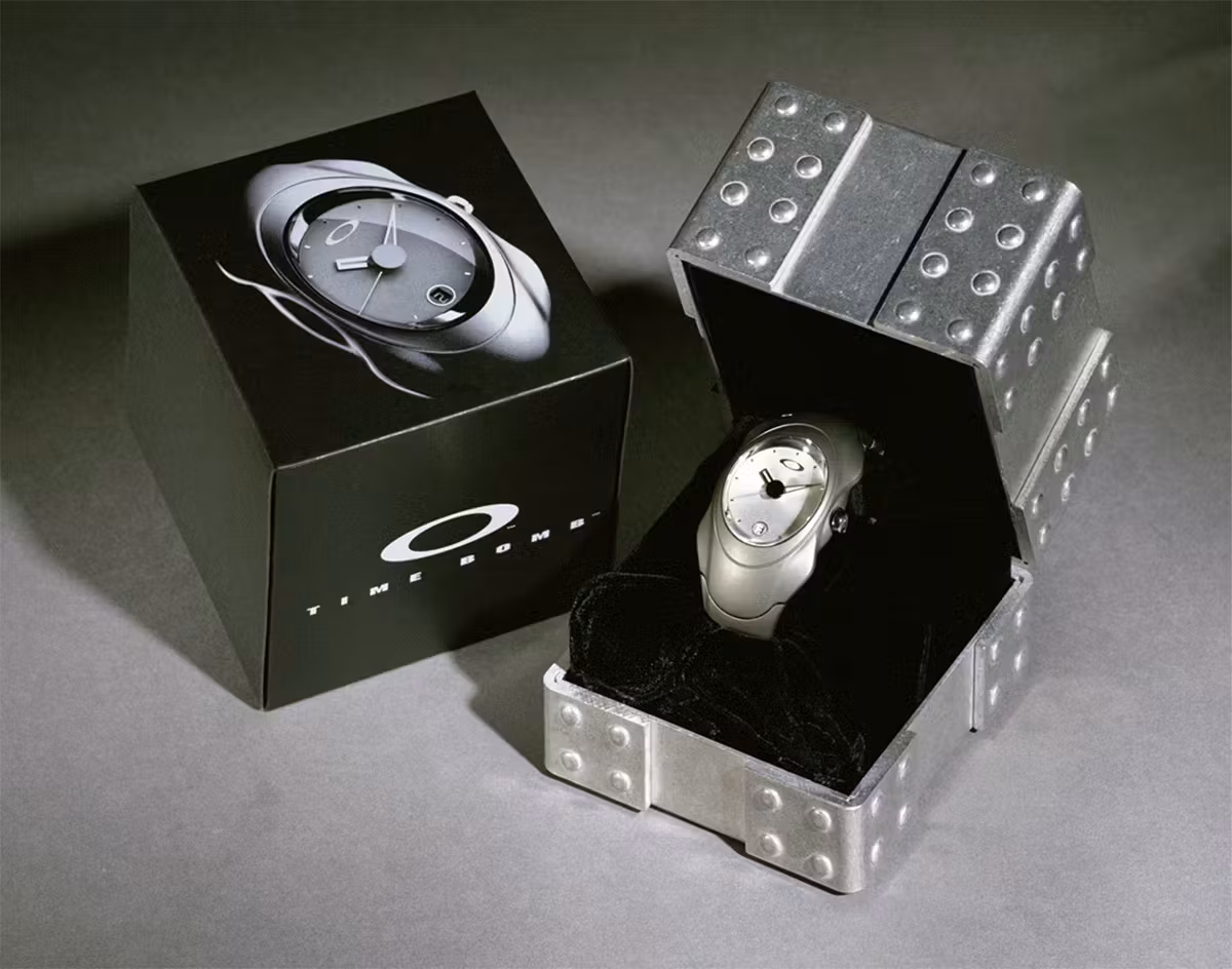 A Oakley Time Bomb watch shown in its original metallic retail packaging