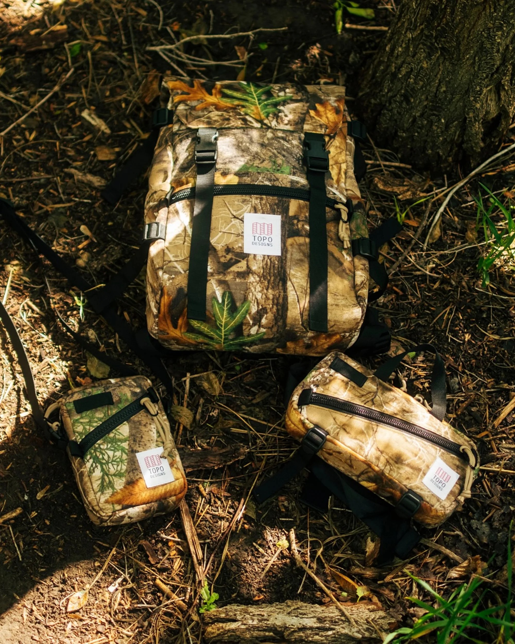 Topo Designs Forest Floor Camo EDC Bags in the woods
