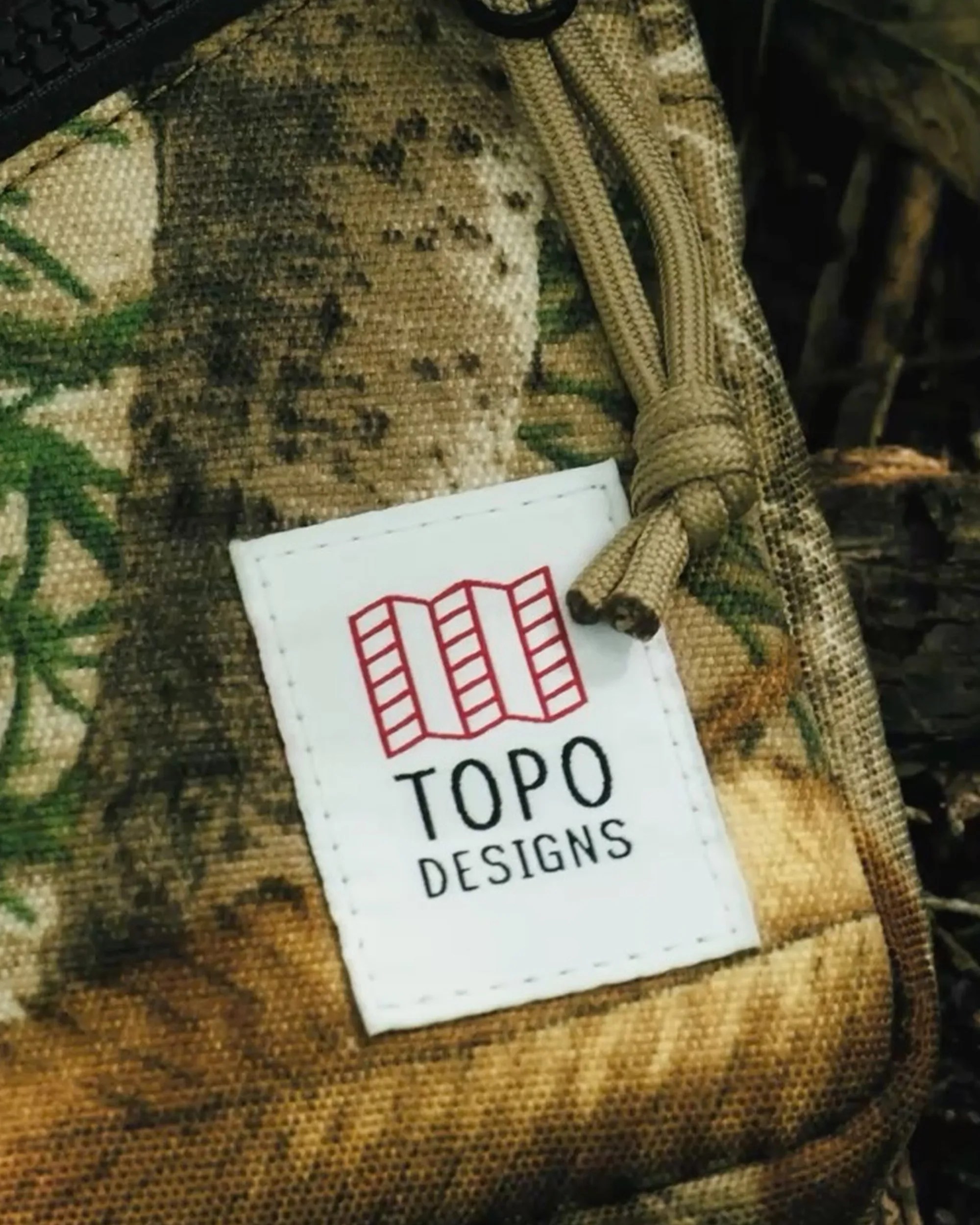 Topo Designs Forest Floor Camo logo closeup