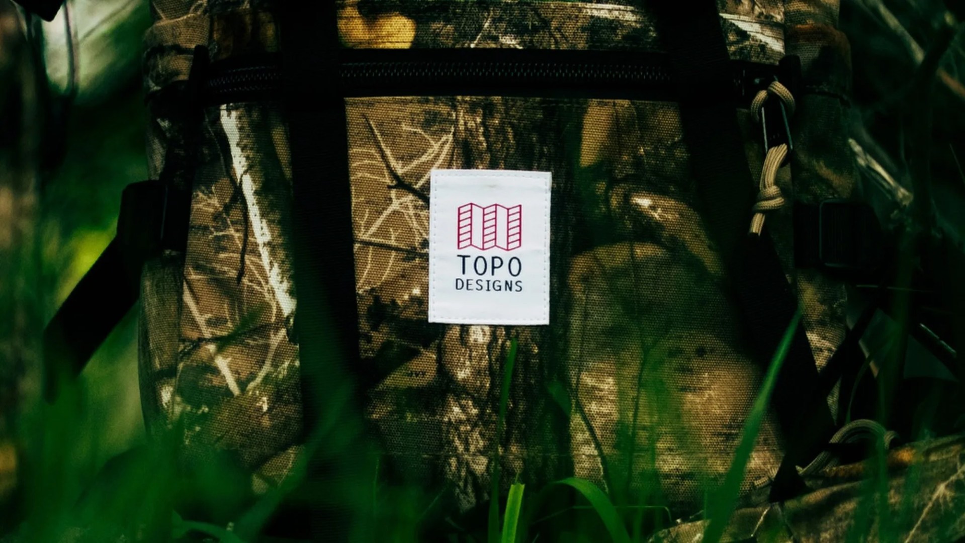 Topo Designs Forest Floor Camo logo closeup