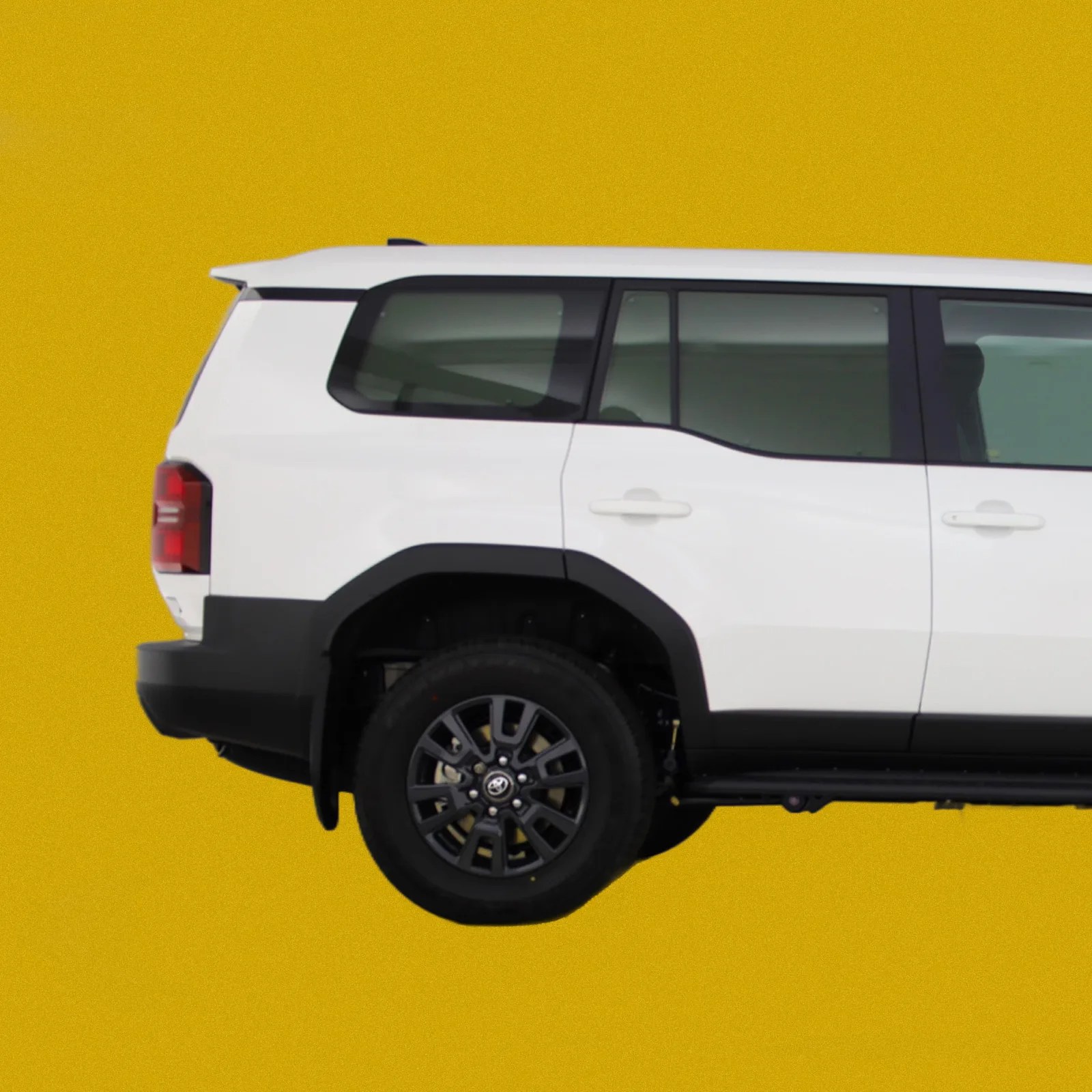 A profile view of the back side of the Toyota Land Cruiser Commercial in White