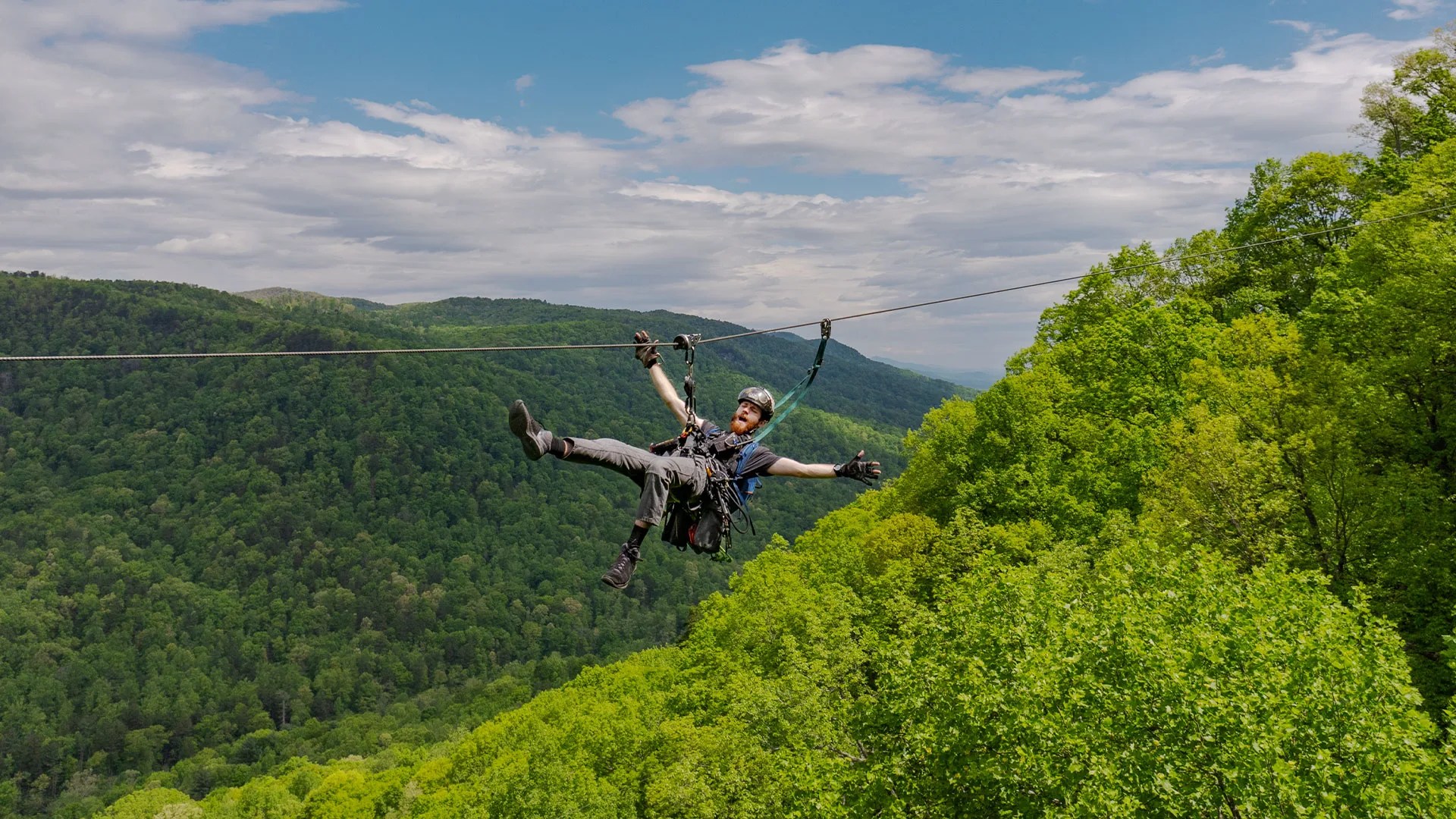 man ziplining at the gorge in saluda