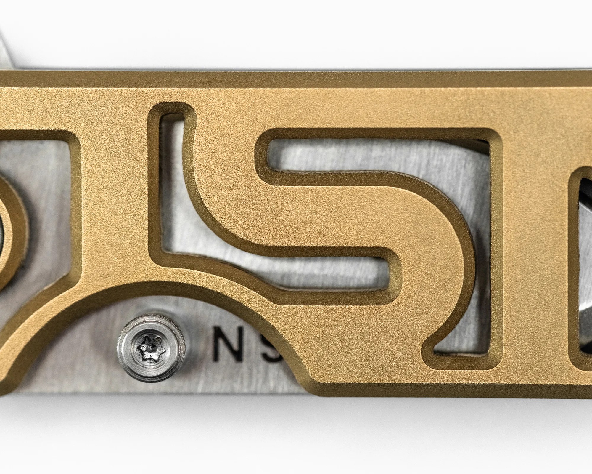 WESN x 1st Magic Puzzle Box and Microblade EDC Knife handle closeup