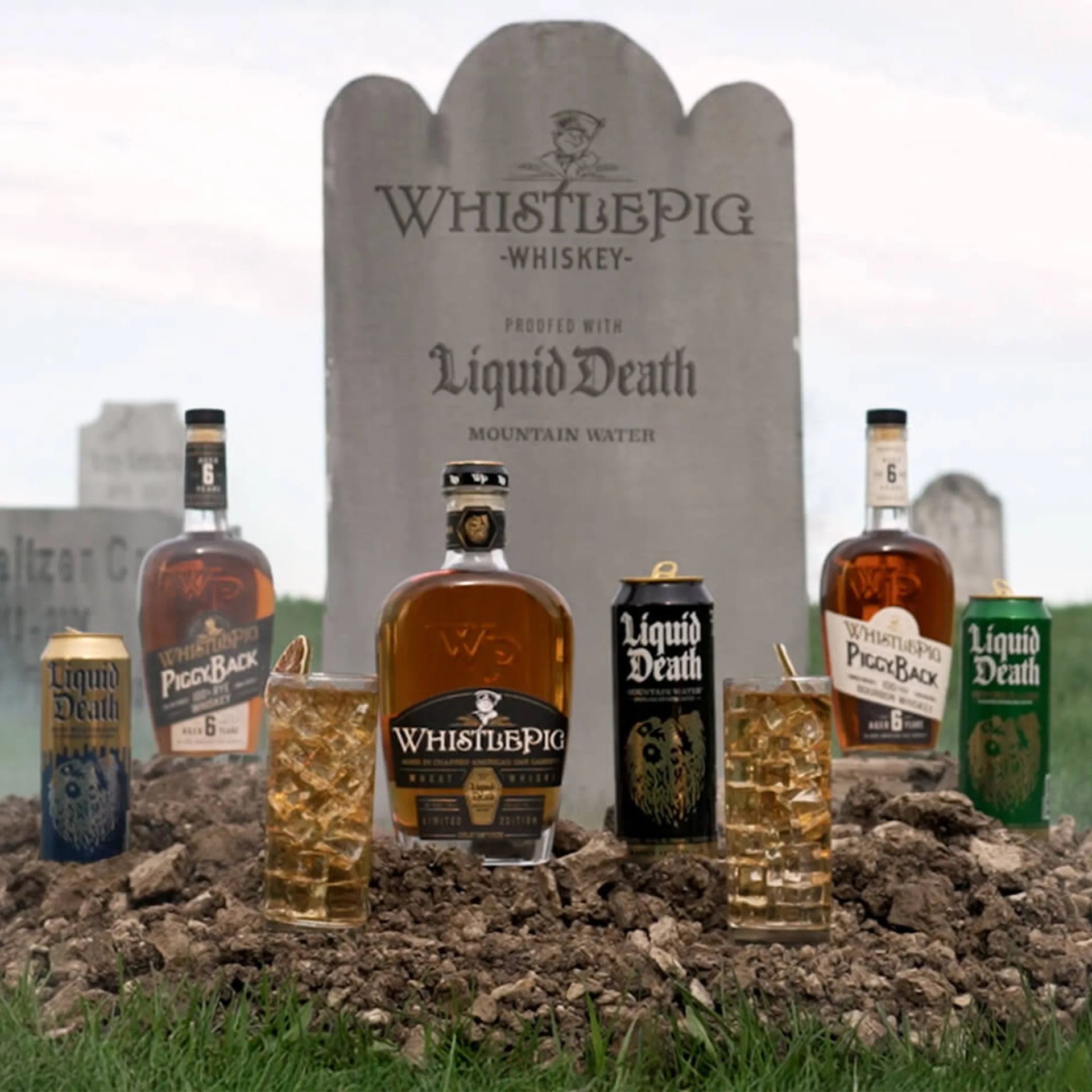 WhistlePig x Liquid Death GraveStock Wheat Whiskey in graveyard with WhistlePig and Liquid Death products