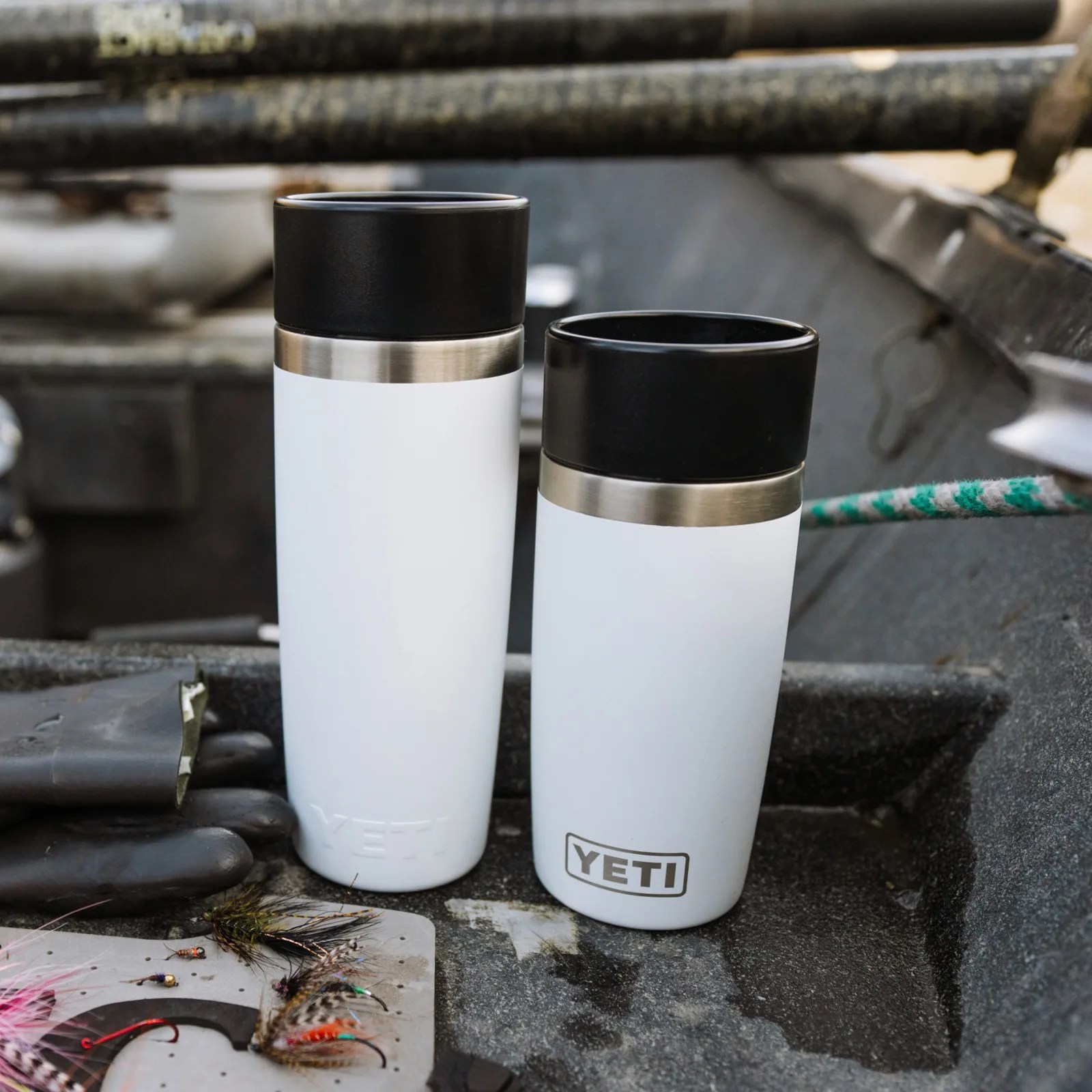 Two Yeti travel cups in 12 and 16 oz sizes in white sitting