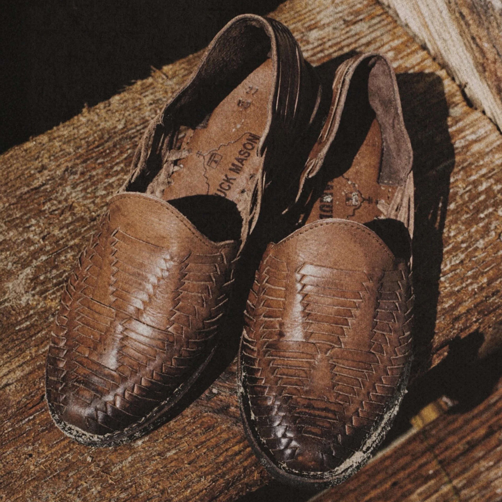 a pair of brown leather shoes