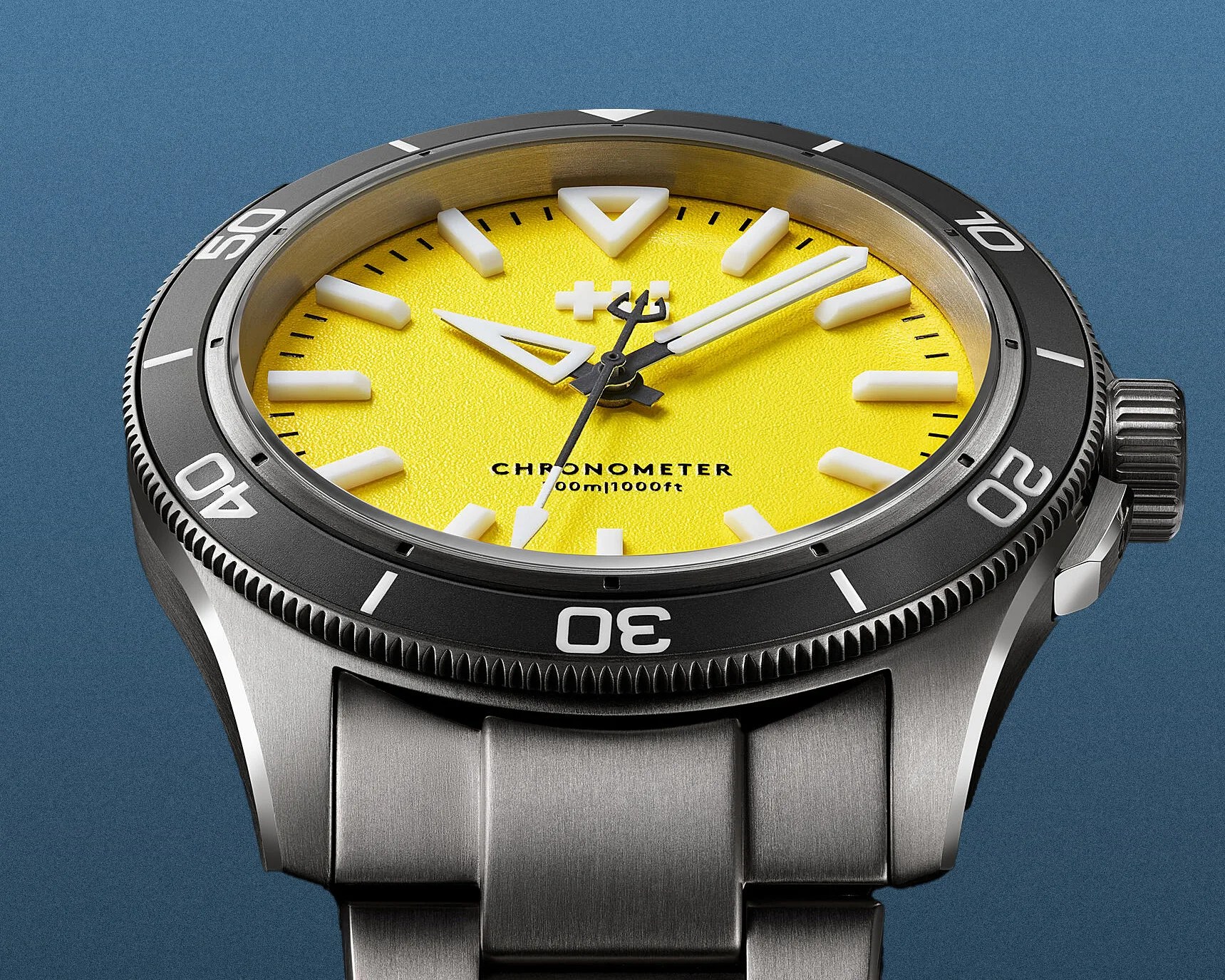 the dial and bezel of a Christopher Ward dive watch