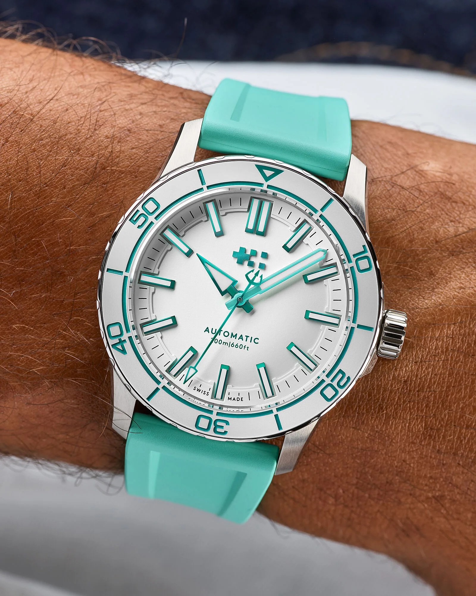 a white and green Christopher Ward dive watch