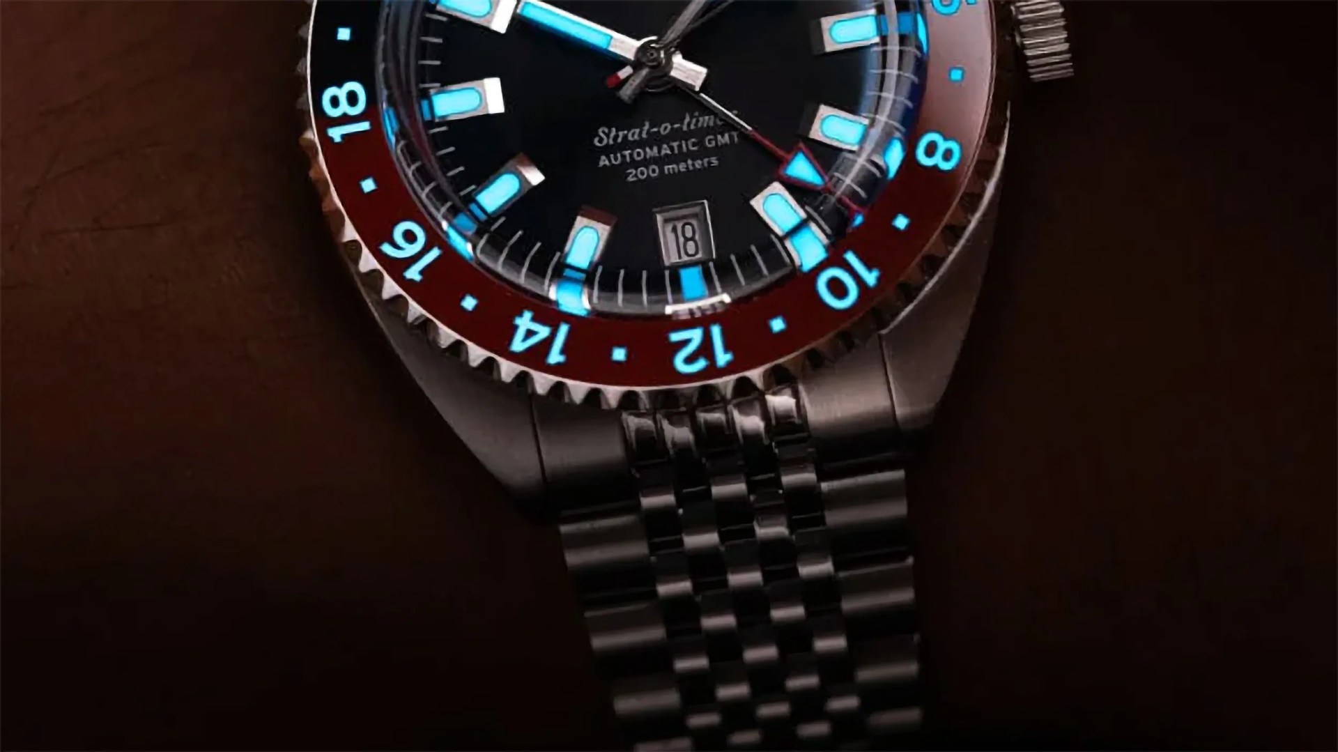 a black and red GMT watch