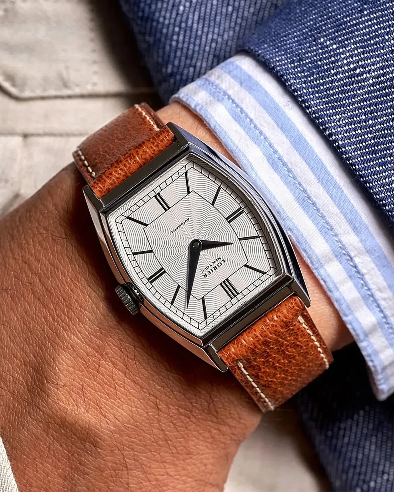a Lorier watch on a man's wrist