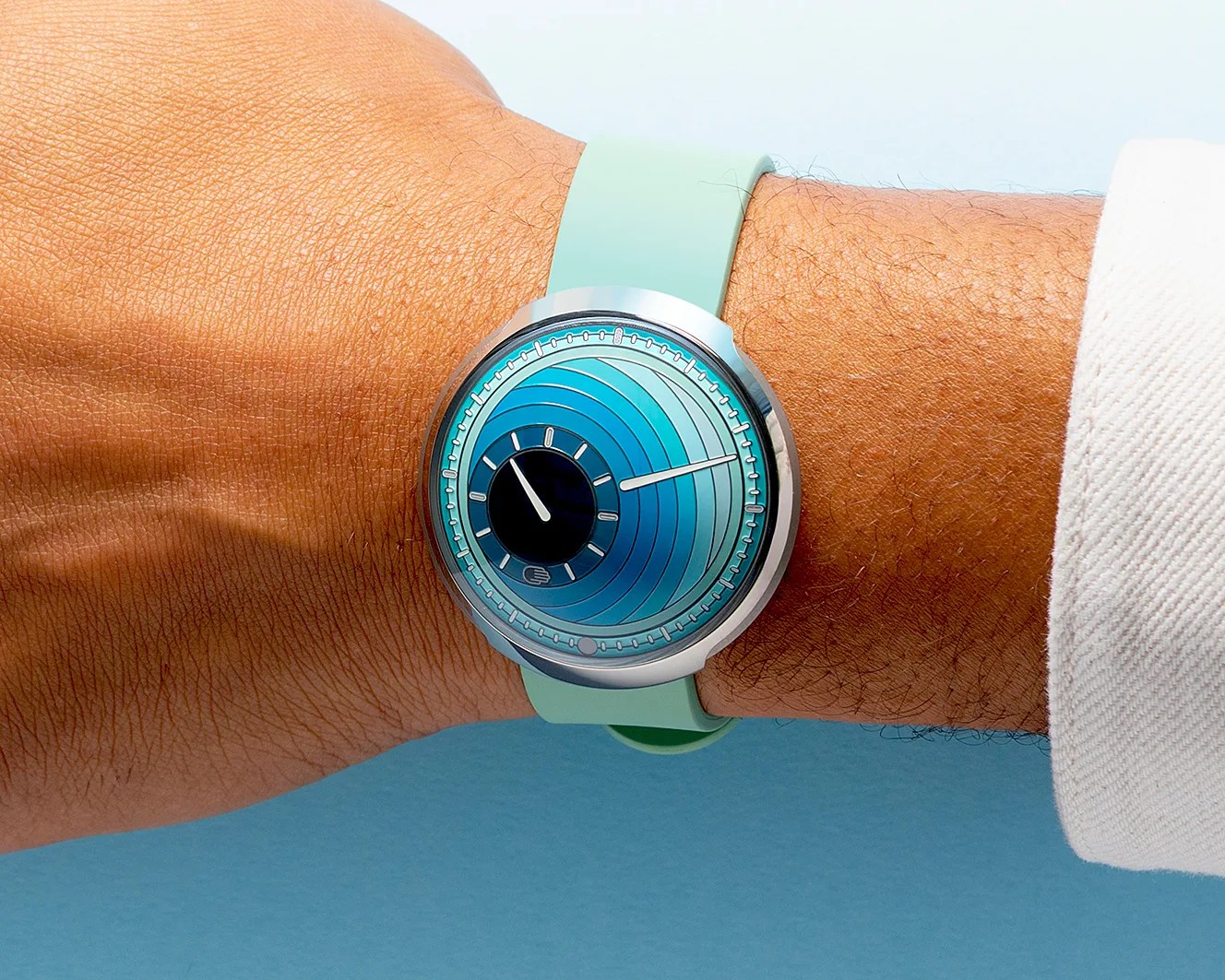 a man wearing a blue Ressence watch